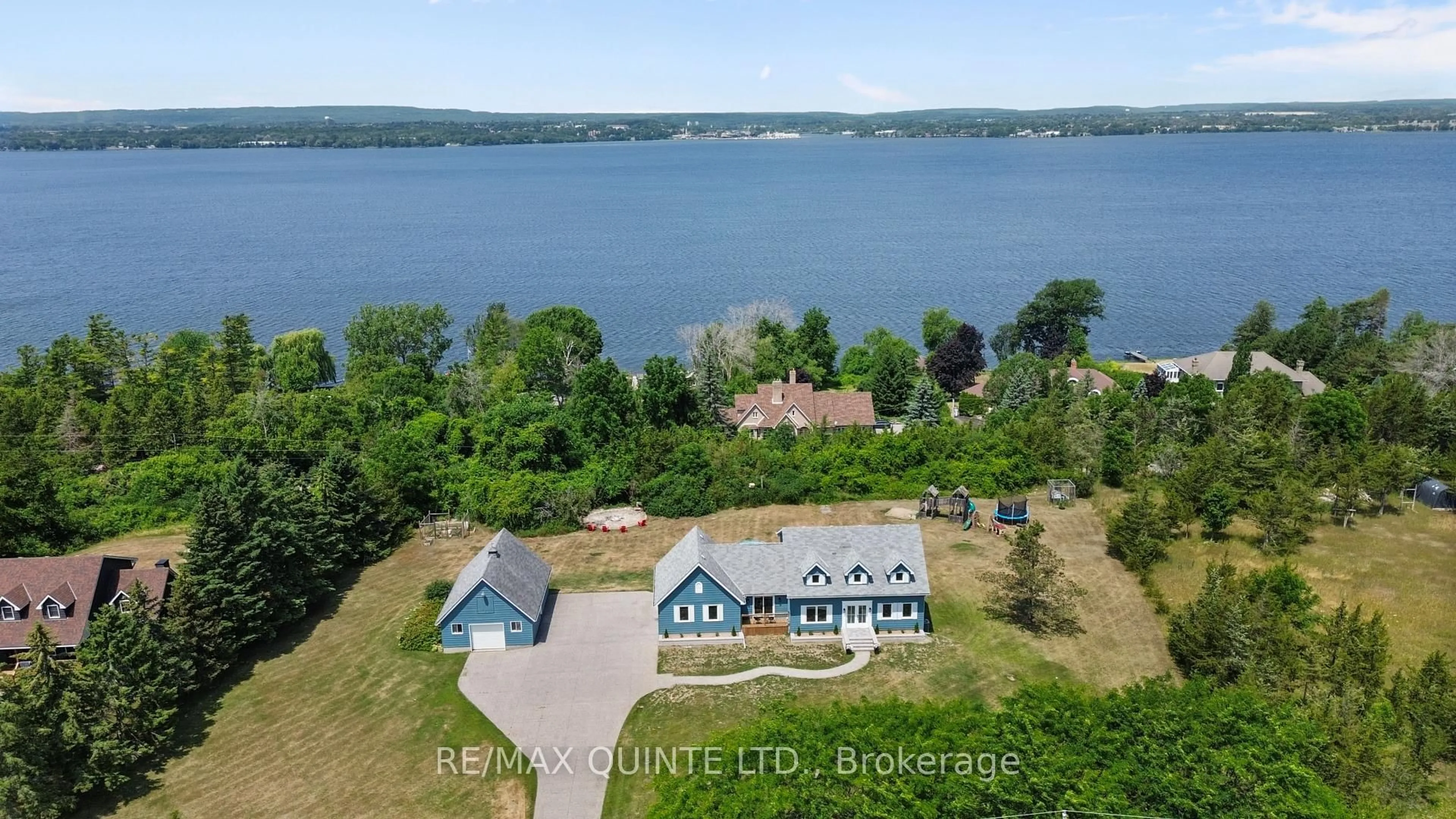 A pic from outside/outdoor area/front of a property/back of a property/a pic from drone, water/lake/river/ocean view for 3130 County Rd 3, Prince Edward County Ontario K0K 1L0