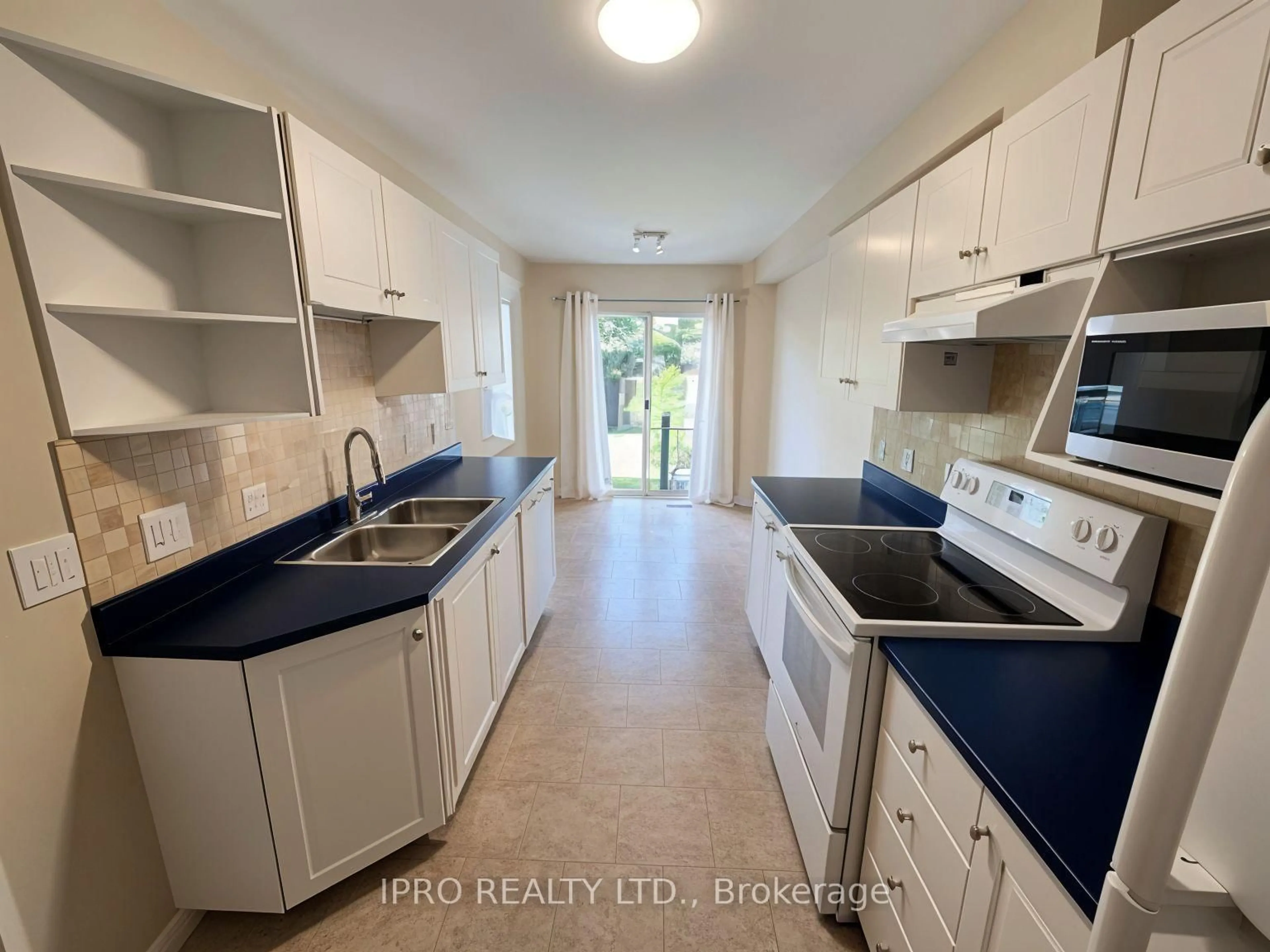 Kitchen with laundary machines, ceramic/tile floor for 447 Molly McGlynn St, Kingston Ontario K7K 7C2