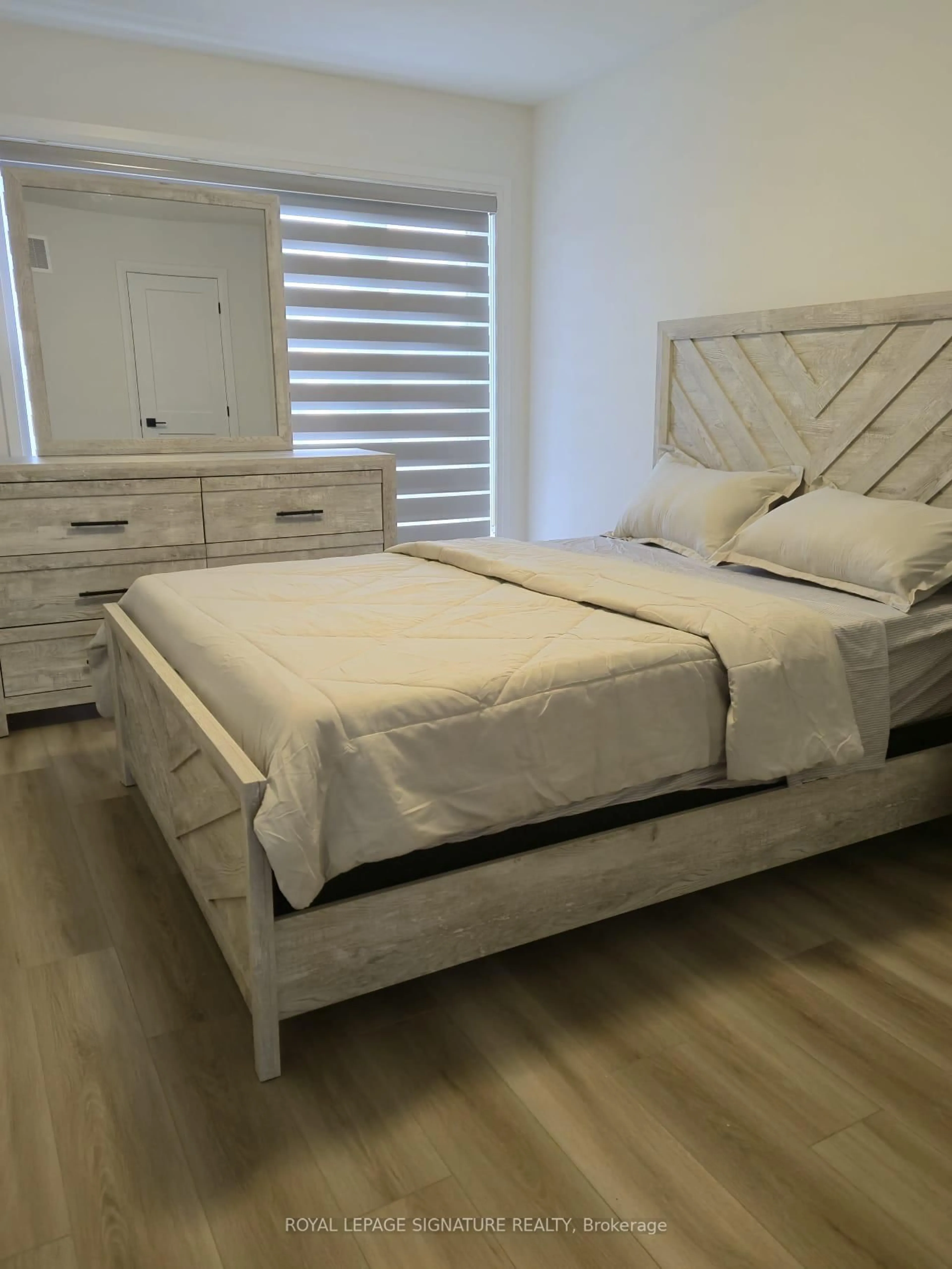 Bedroom with bed, wood/laminate floor for 55 Tom Brown Dr, Brant Ontario N3L 0N5