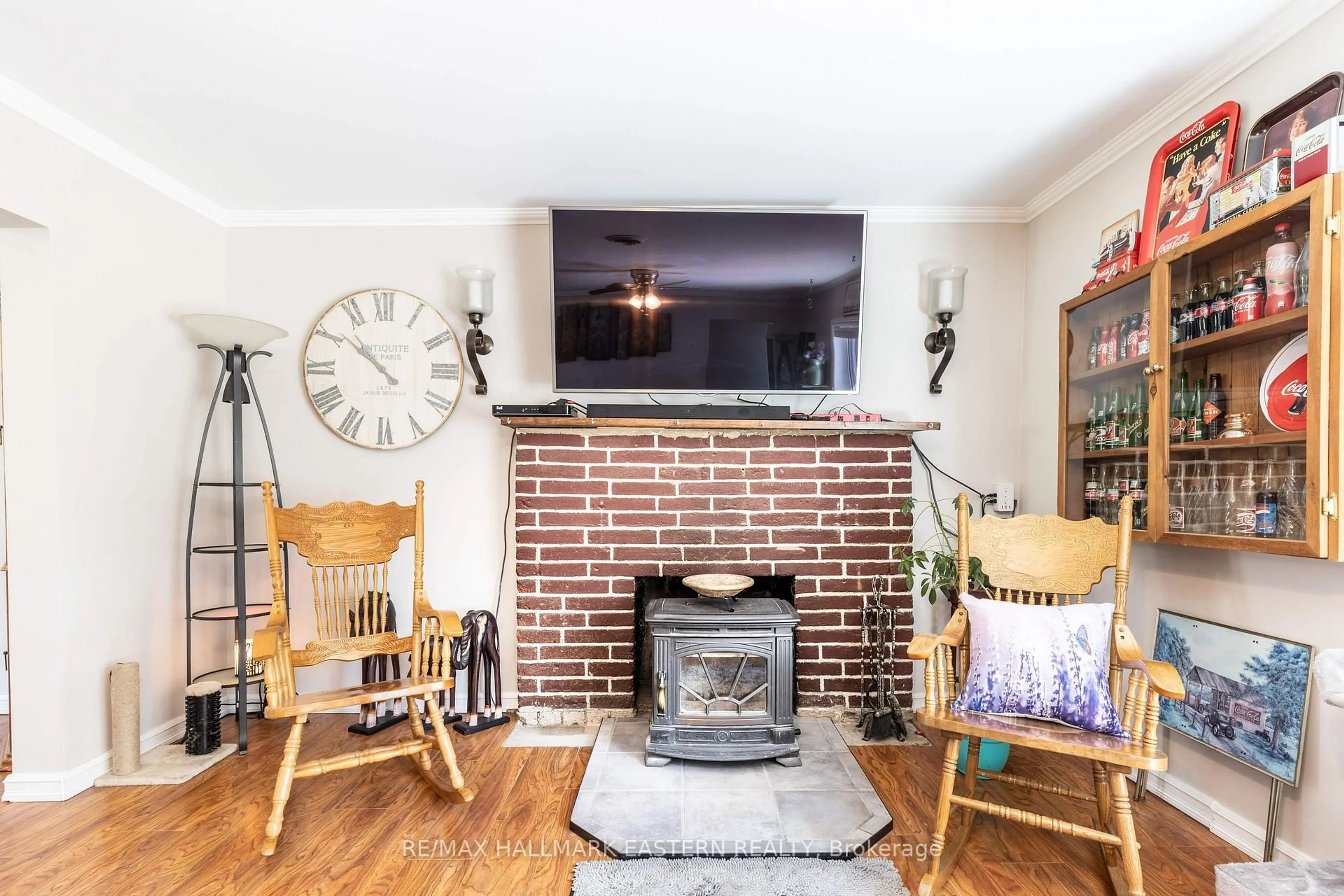 Living room with furniture, wood/laminate floor for 4792 Hwy 7, Douro-Dummer Ontario K0L 2V0