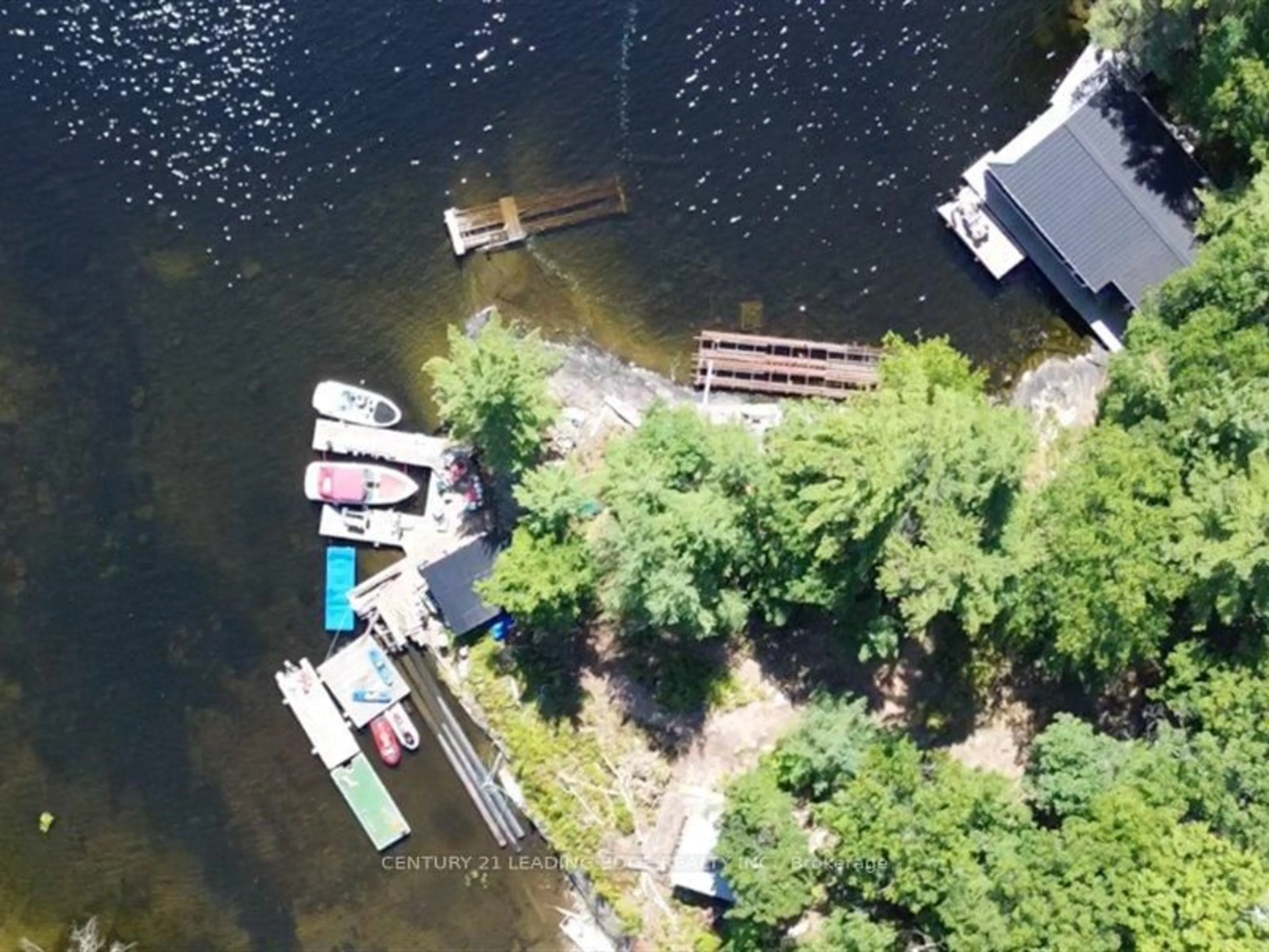 A pic from outside/outdoor area/front of a property/back of a property/a pic from drone, water/lake/river/ocean view for 2077 Lake Muskoka Shr, Muskoka Lakes Ontario P0C 1M0