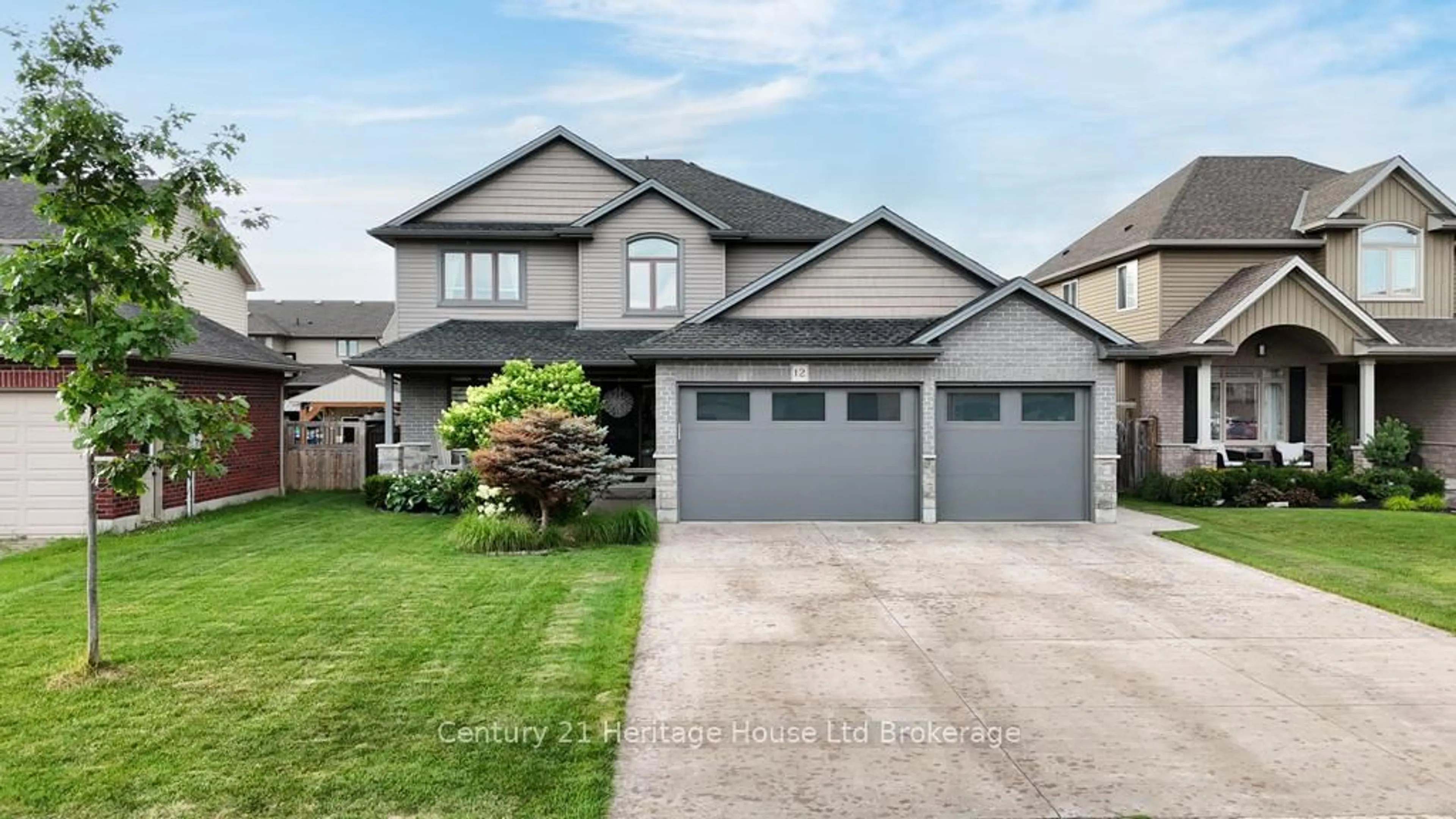 Home with vinyl exterior material, street for 12 Oliver Cres, Zorra Ontario N0M 2M0