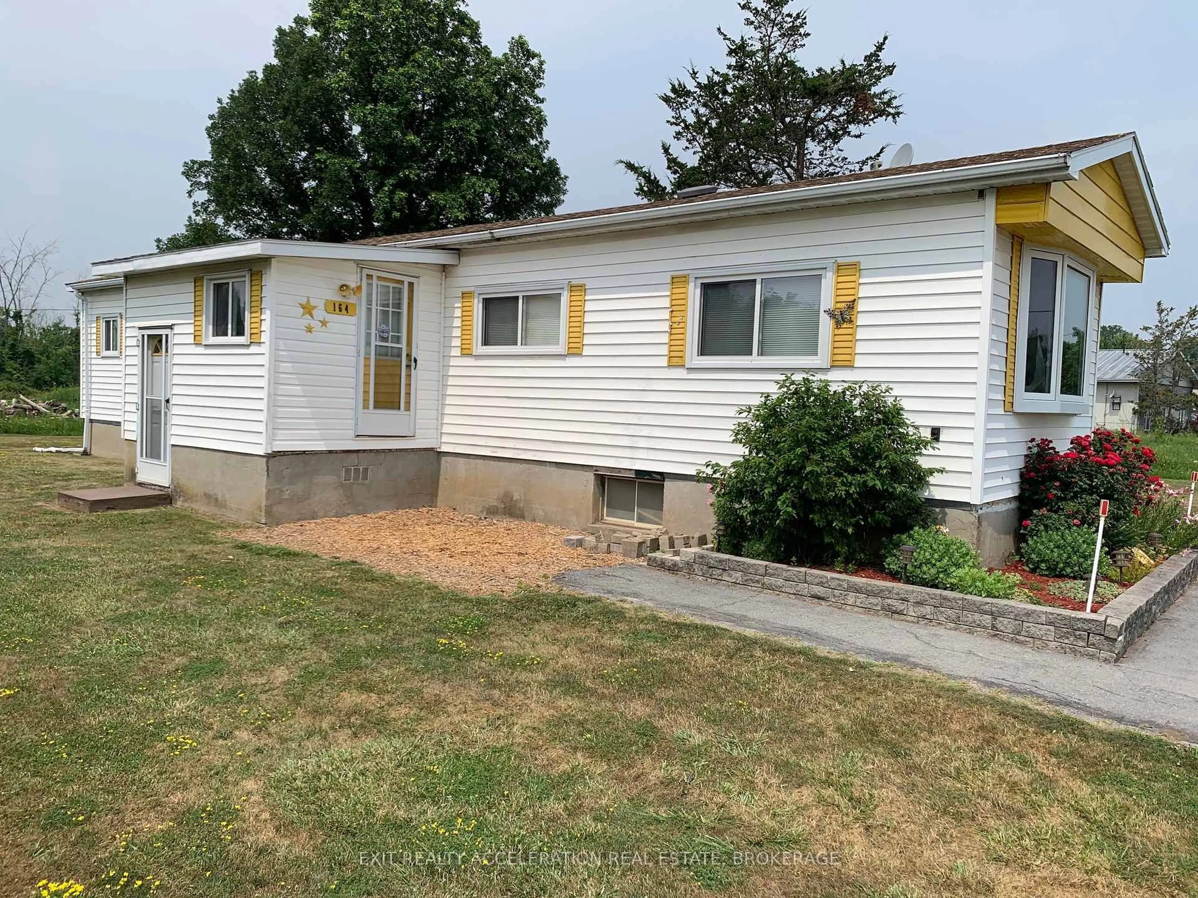 Home with vinyl exterior material, street for 164 Kimmett's Sdrd, Plantagenet Ontario K7R 3L2