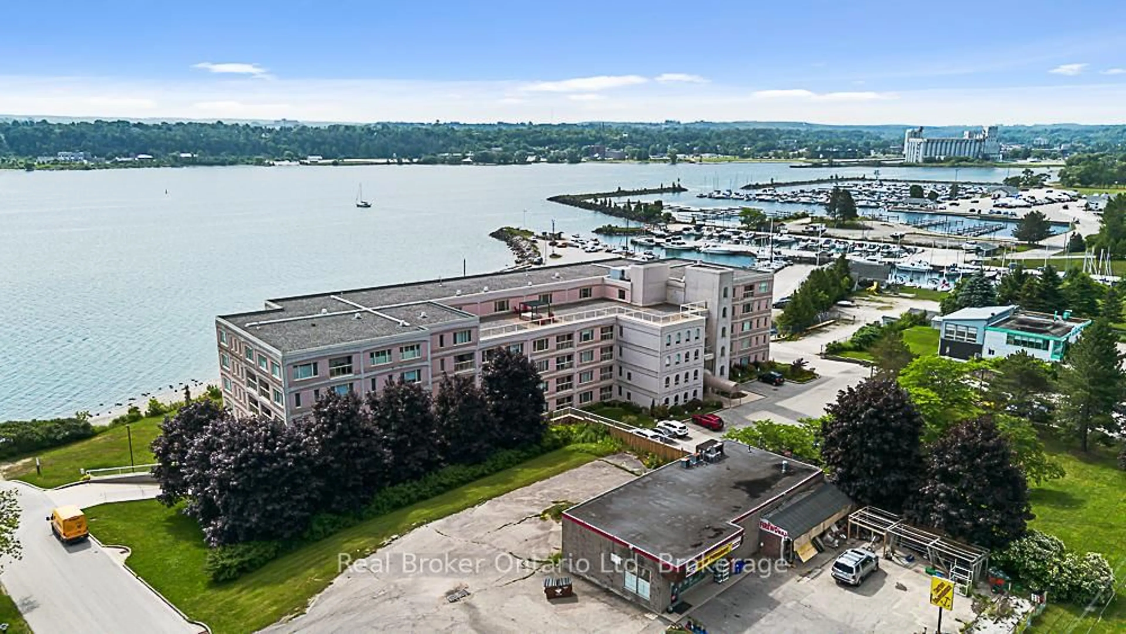 A pic from outside/outdoor area/front of a property/back of a property/a pic from drone, water/lake/river/ocean view for 2555 3rd Ave #310, Owen Sound Ontario N4K 6T8