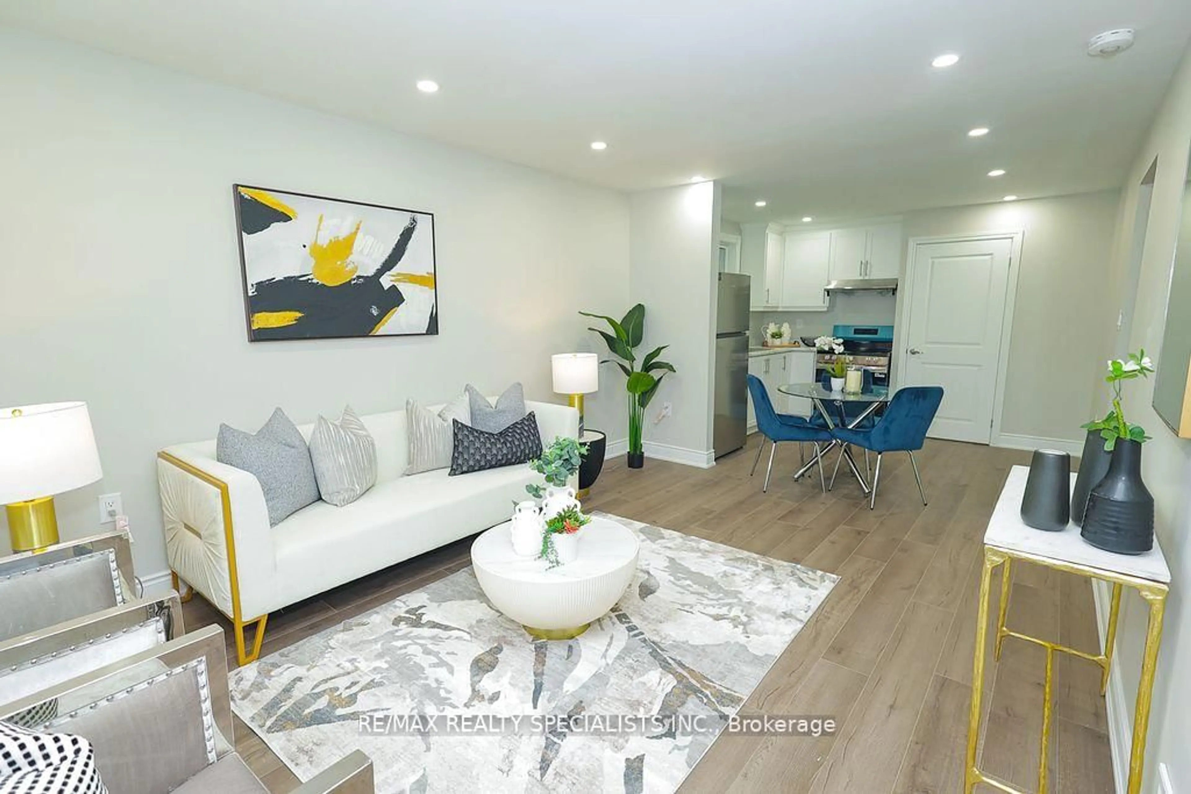 Living room with furniture, wood/laminate floor for 5097 Ontario Ave, Niagara Falls Ontario L2E 3R7