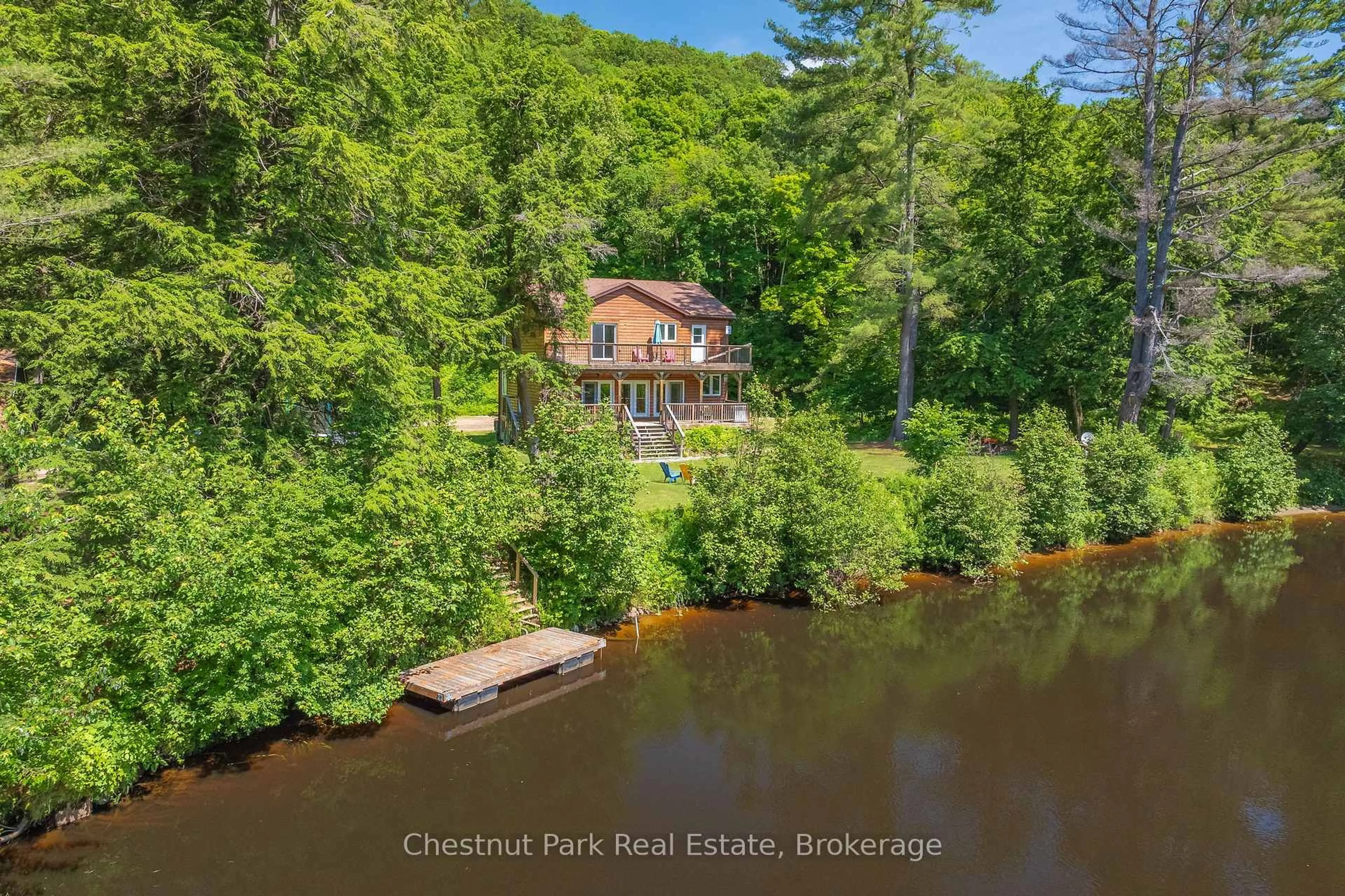 A pic from outside/outdoor area/front of a property/back of a property/a pic from drone, water/lake/river/ocean view for 66 Bridgeview Lane, Huntsville Ontario P1H 2N5
