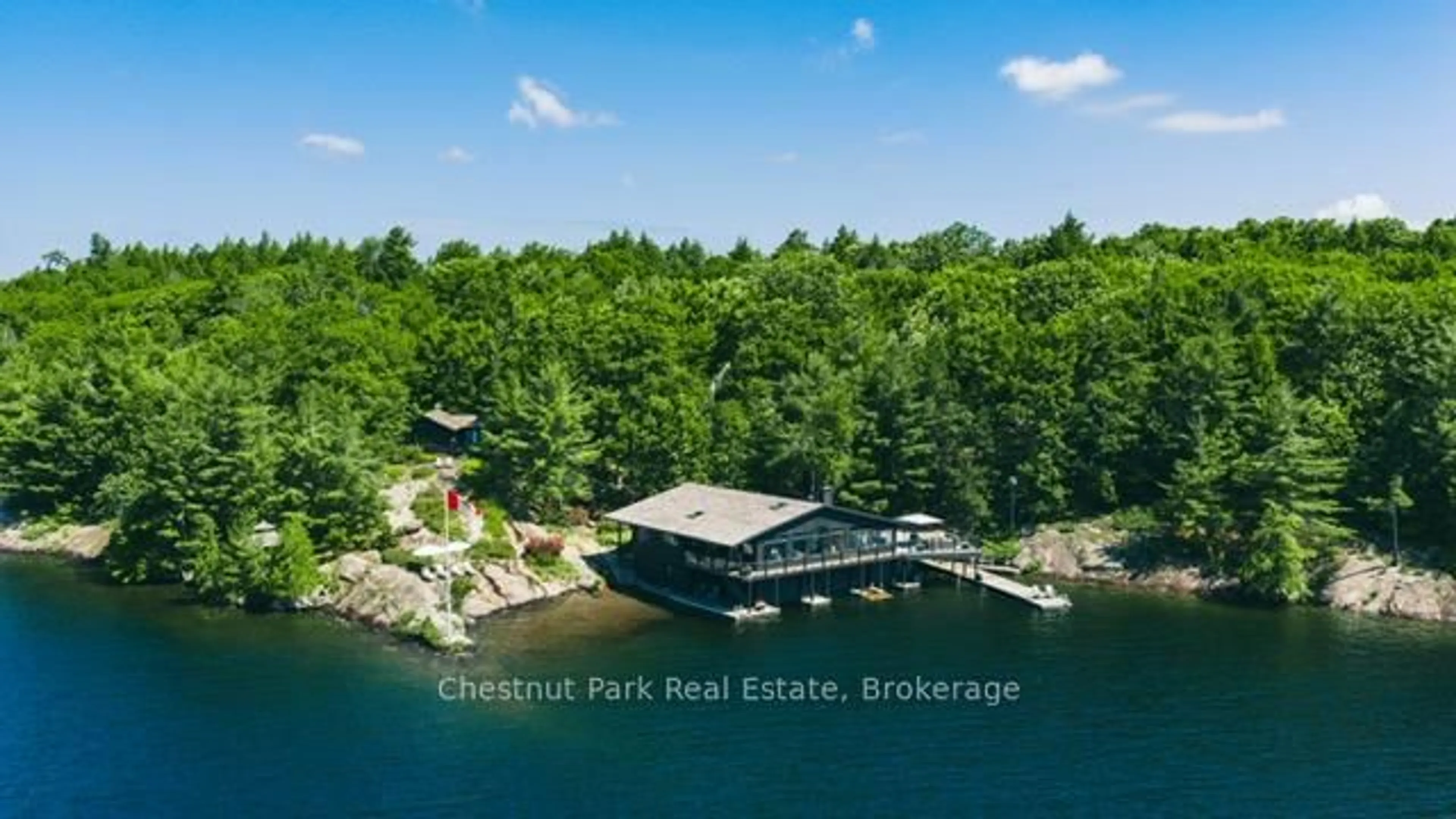 A pic from outside/outdoor area/front of a property/back of a property/a pic from drone, water/lake/river/ocean view for 22 J18 Badgerow Island, Muskoka Lakes Ontario P0B 1J0