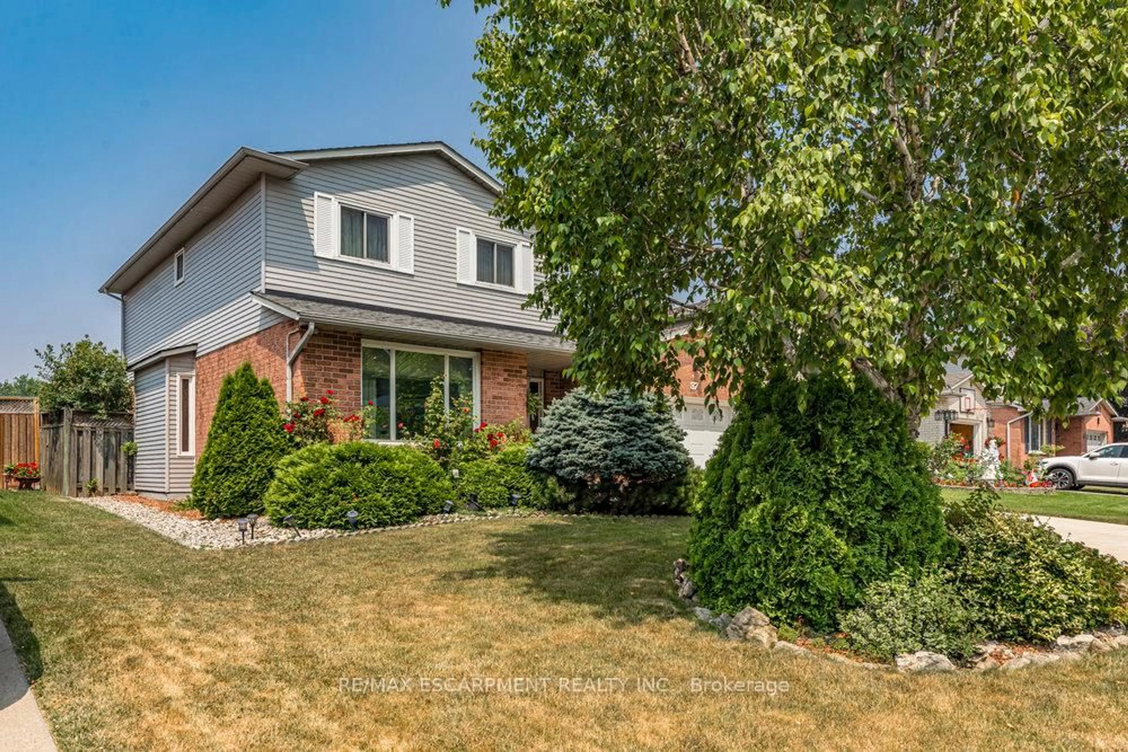 Home with brick exterior material, street for 87 Strawberry Dr, Hamilton Ontario L8E 4R3