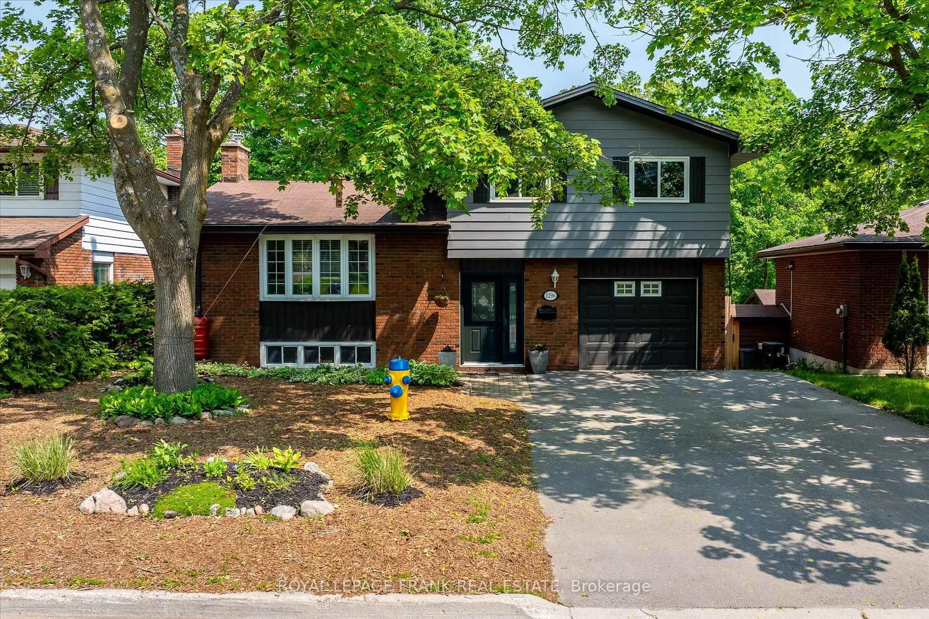 Home with brick exterior material, street for 1296 Cartier Blvd, Peterborough Ontario K9H 6S1