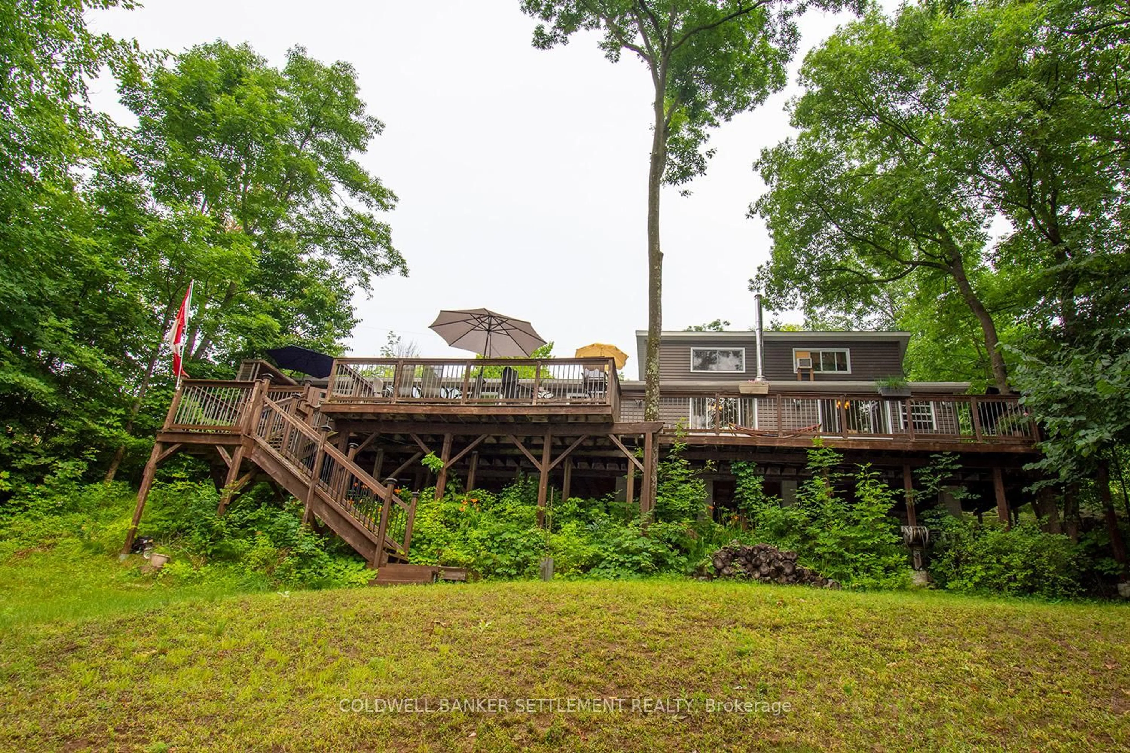 A pic from outside/outdoor area/front of a property/back of a property/a pic from drone, water/lake/river/ocean view for 101 Island Drive Lane, Maberly Ontario K0H 2B0