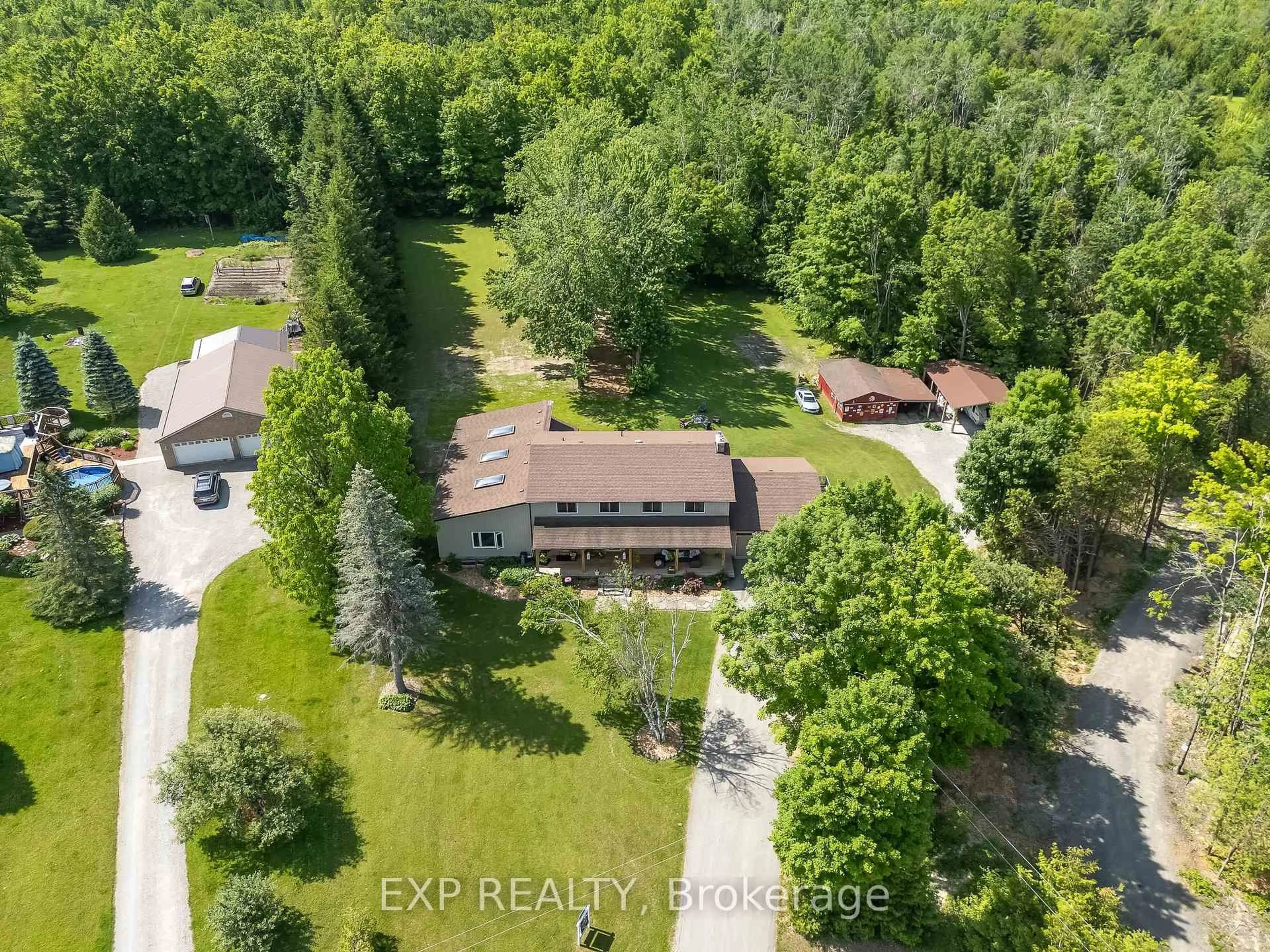 A pic from outside/outdoor area/front of a property/back of a property/a pic from drone, forest/trees view for 667 Ford Cres, Cavan Monaghan Ontario L0A 1C0