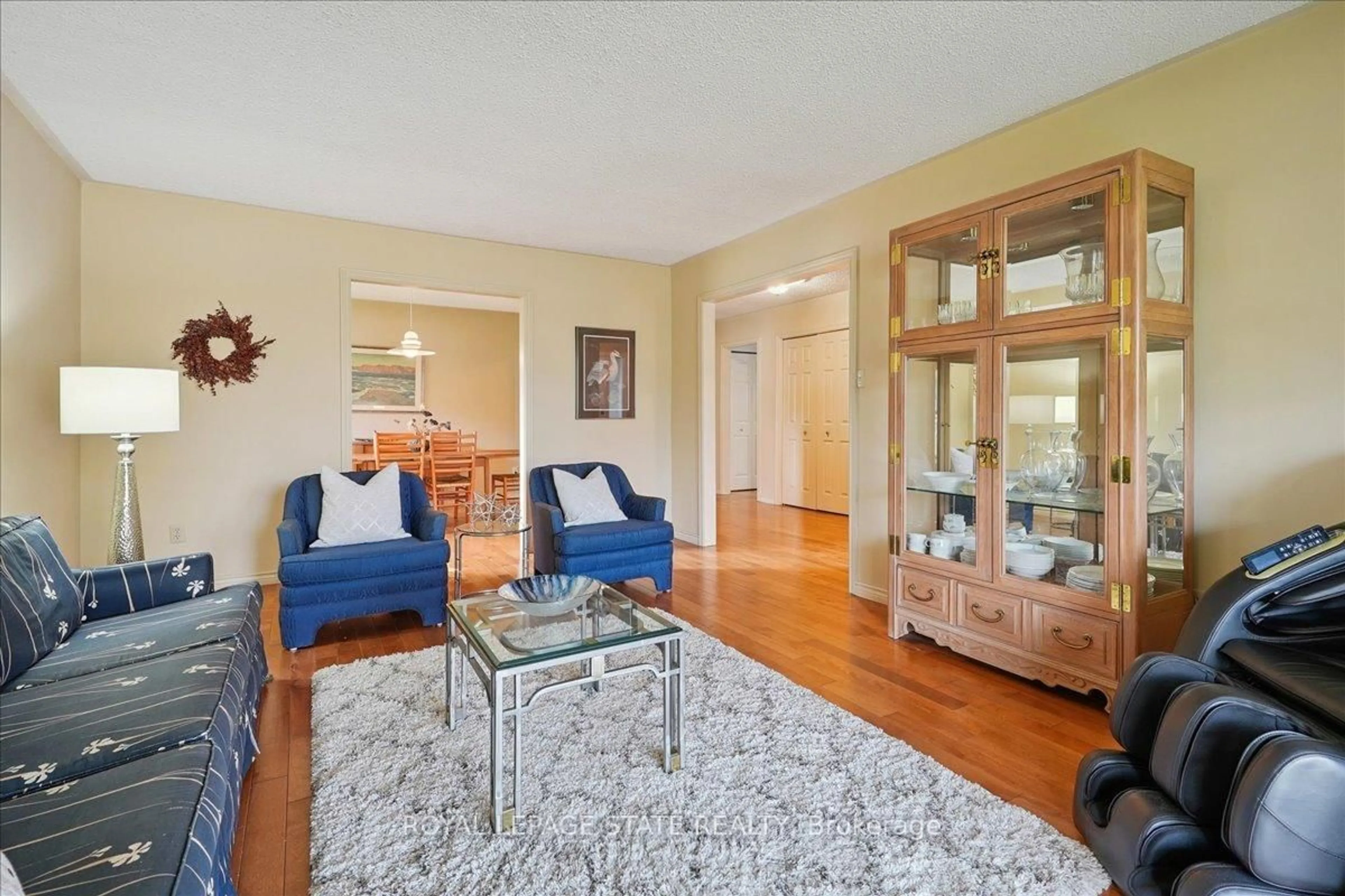Living room with furniture, wood/laminate floor for 16 Stella Crt, Hamilton Ontario L9C 6S7