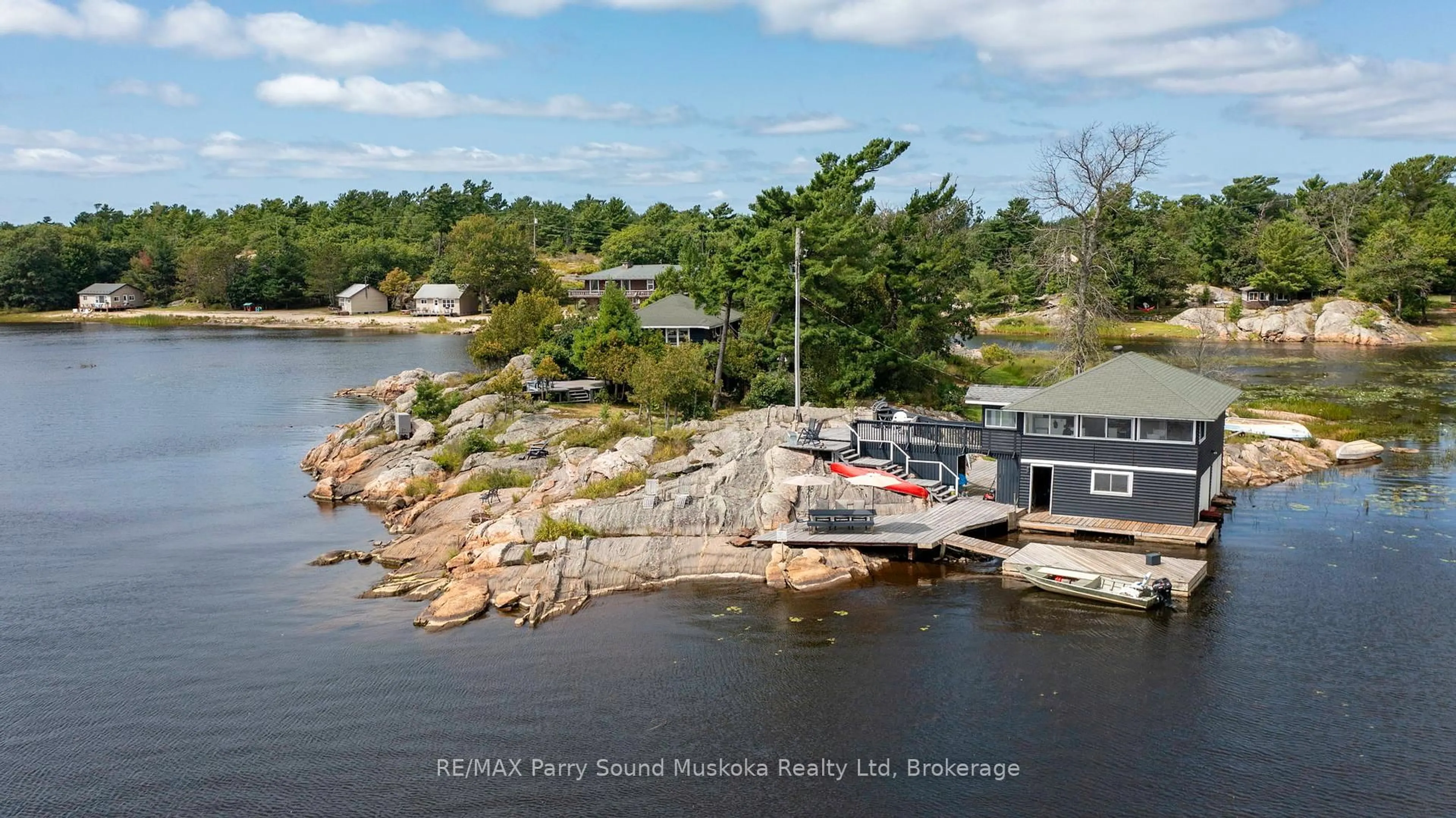 A pic from outside/outdoor area/front of a property/back of a property/a pic from drone, water/lake/river/ocean view for 1 ISLAND 271C, Carling Ontario P0G 1G0