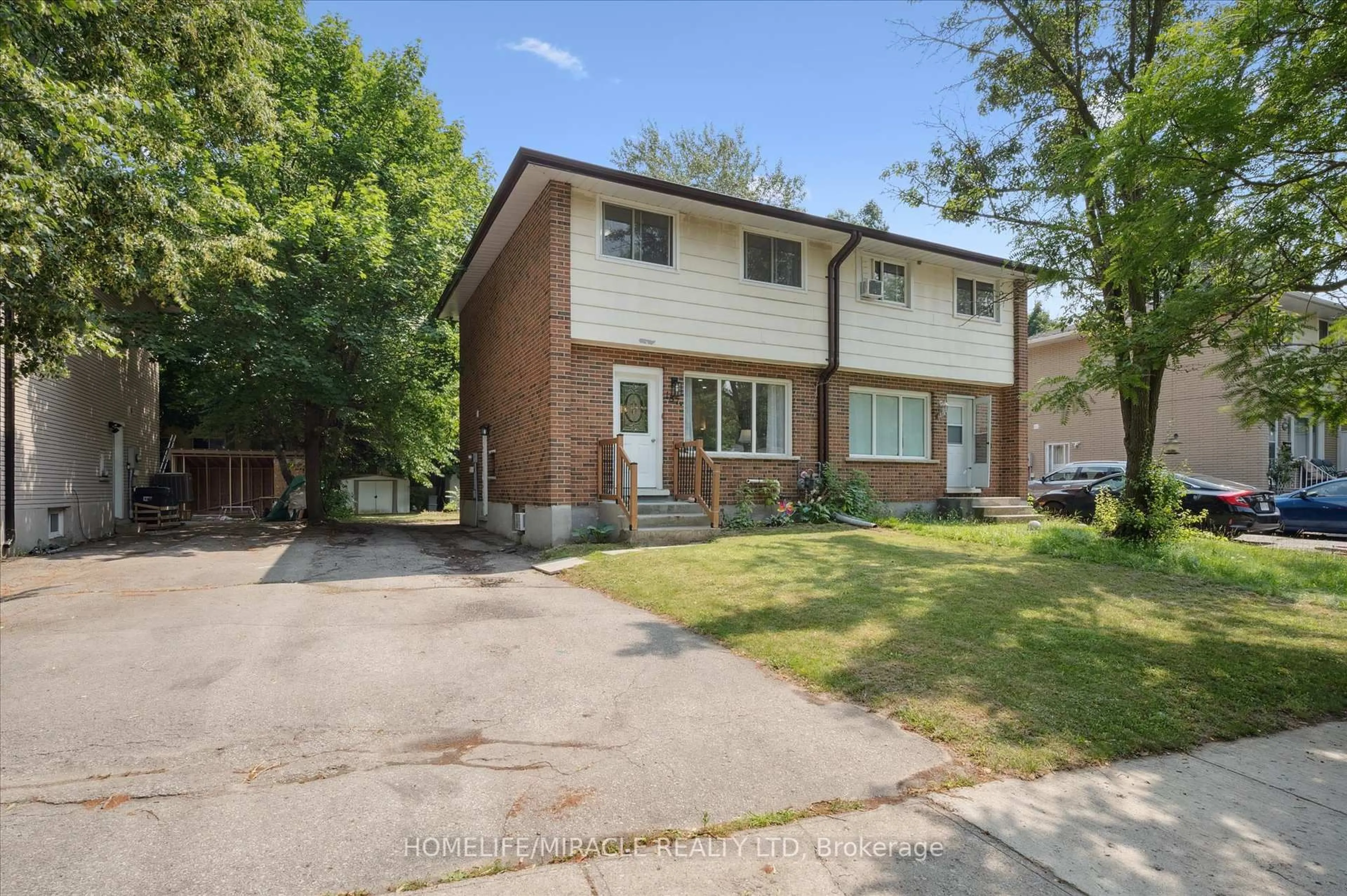 Home with brick exterior material, street for 187A Cedarvale Cres, Waterloo Ontario N2L 4T3