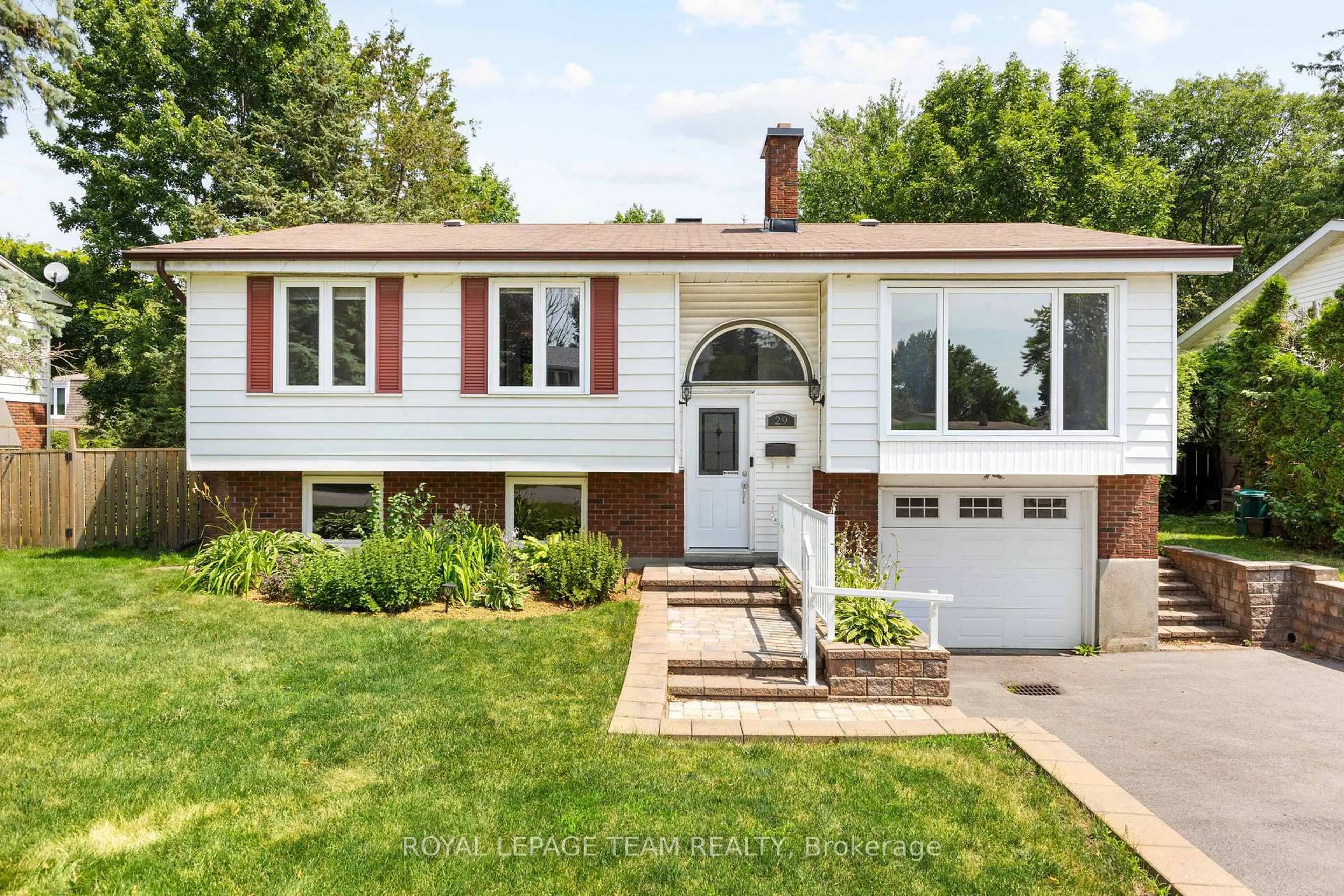 Home with vinyl exterior material, street for 29 Ashgrove Cres, Ottawa Ontario K2G 0S1