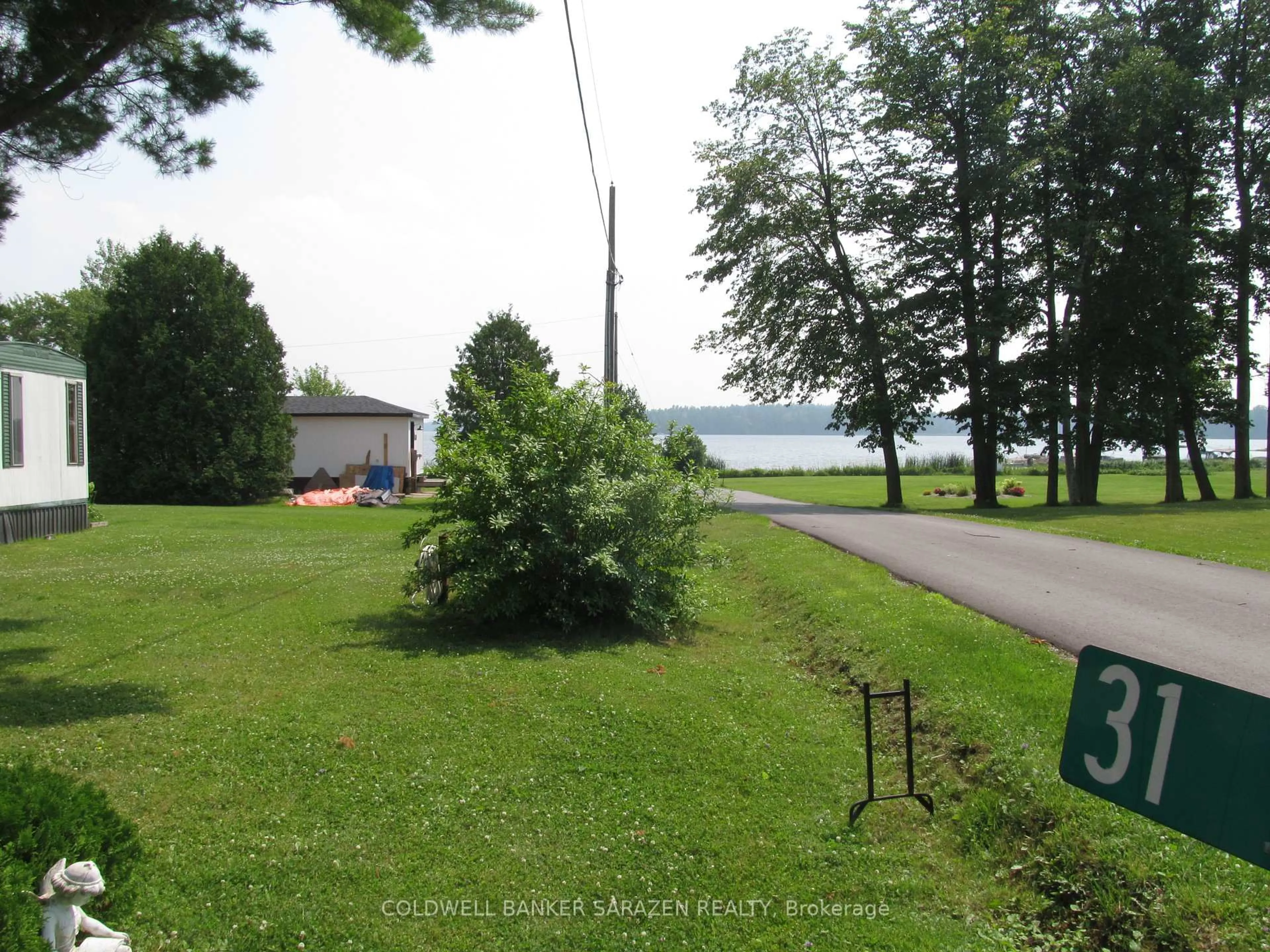 A pic from outside/outdoor area/front of a property/back of a property/a pic from drone, water/lake/river/ocean view for 31 Lakefront Lane, White Lake Ontario K0A 3L0