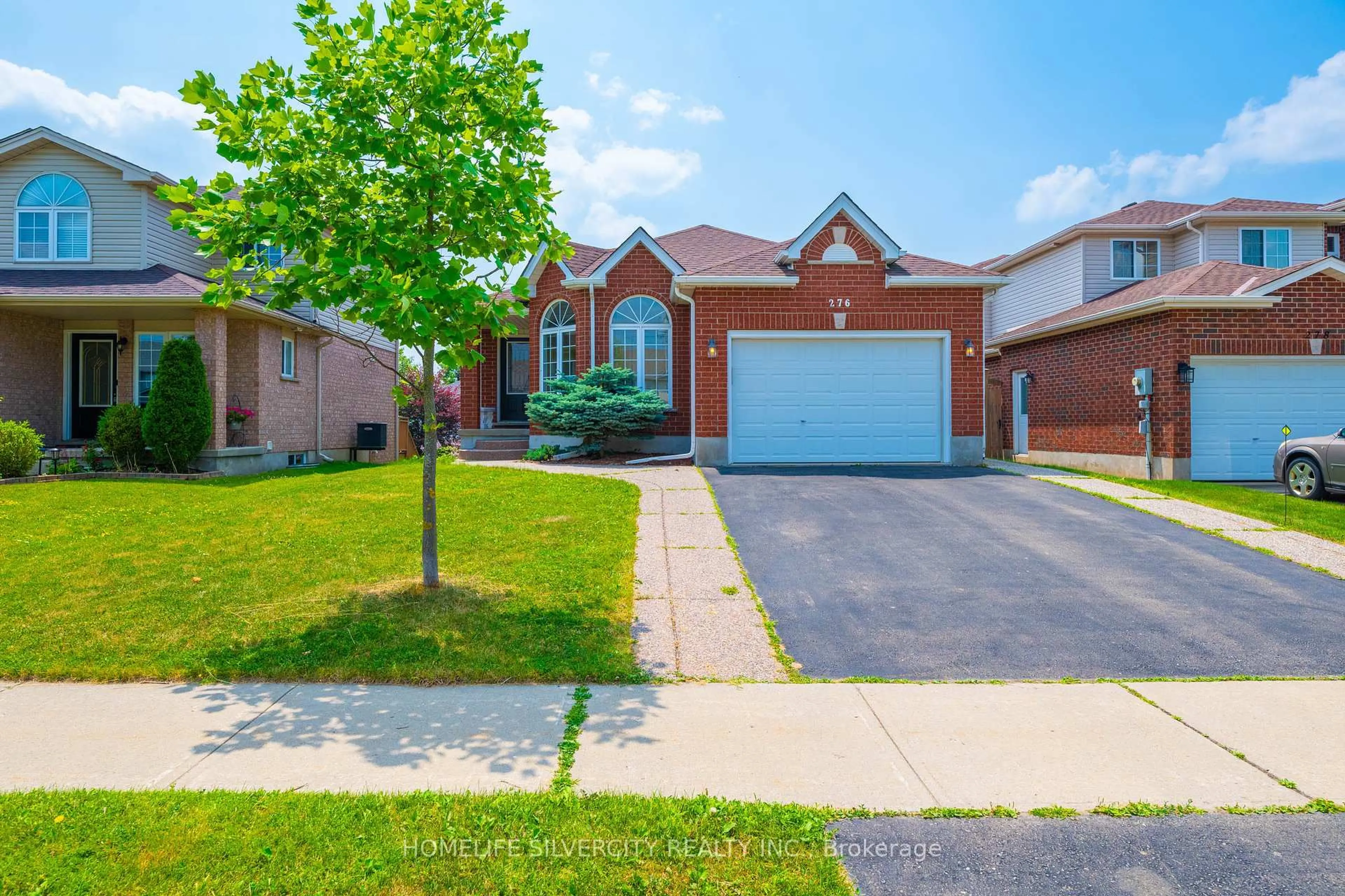 Home with brick exterior material, street for 276 Watson Pkwy, Guelph Ontario N1E 7J5