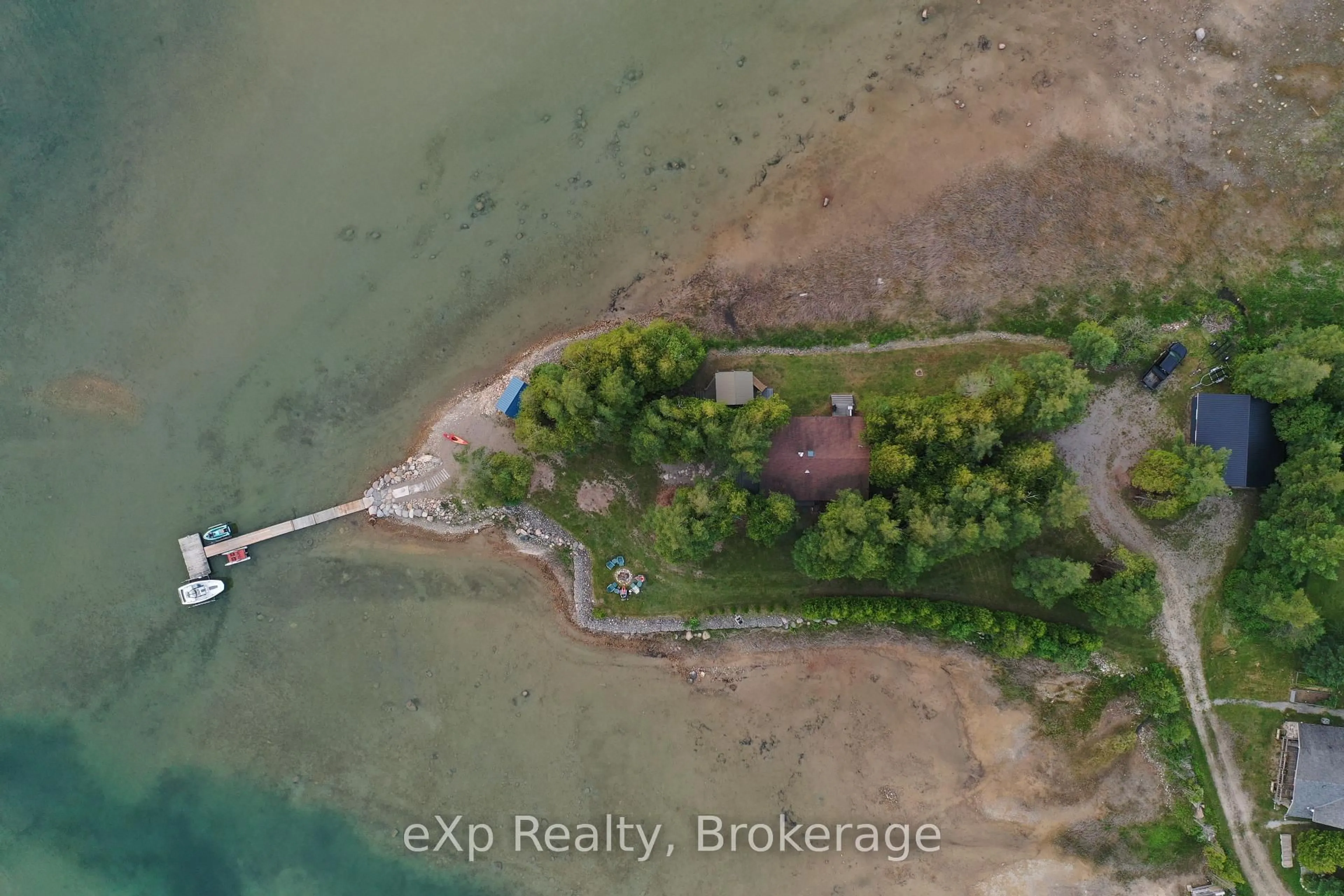 A pic from outside/outdoor area/front of a property/back of a property/a pic from drone, water/lake/river/ocean view for 32 Doerr Dr, Northern Bruce Peninsula Ontario N0H 1W0