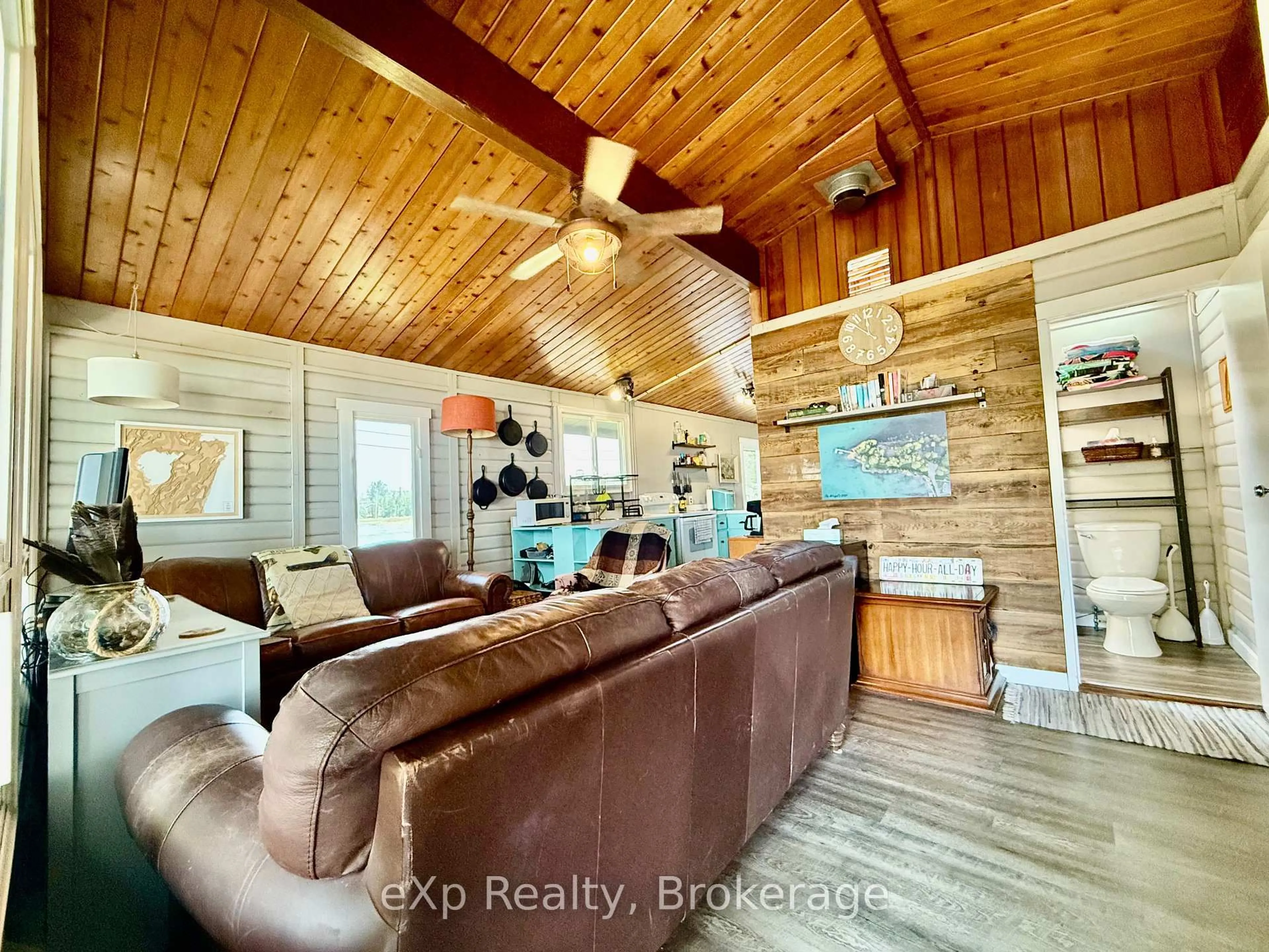 Living room with furniture, wood/laminate floor for 32 Doerr Dr, Northern Bruce Peninsula Ontario N0H 1W0