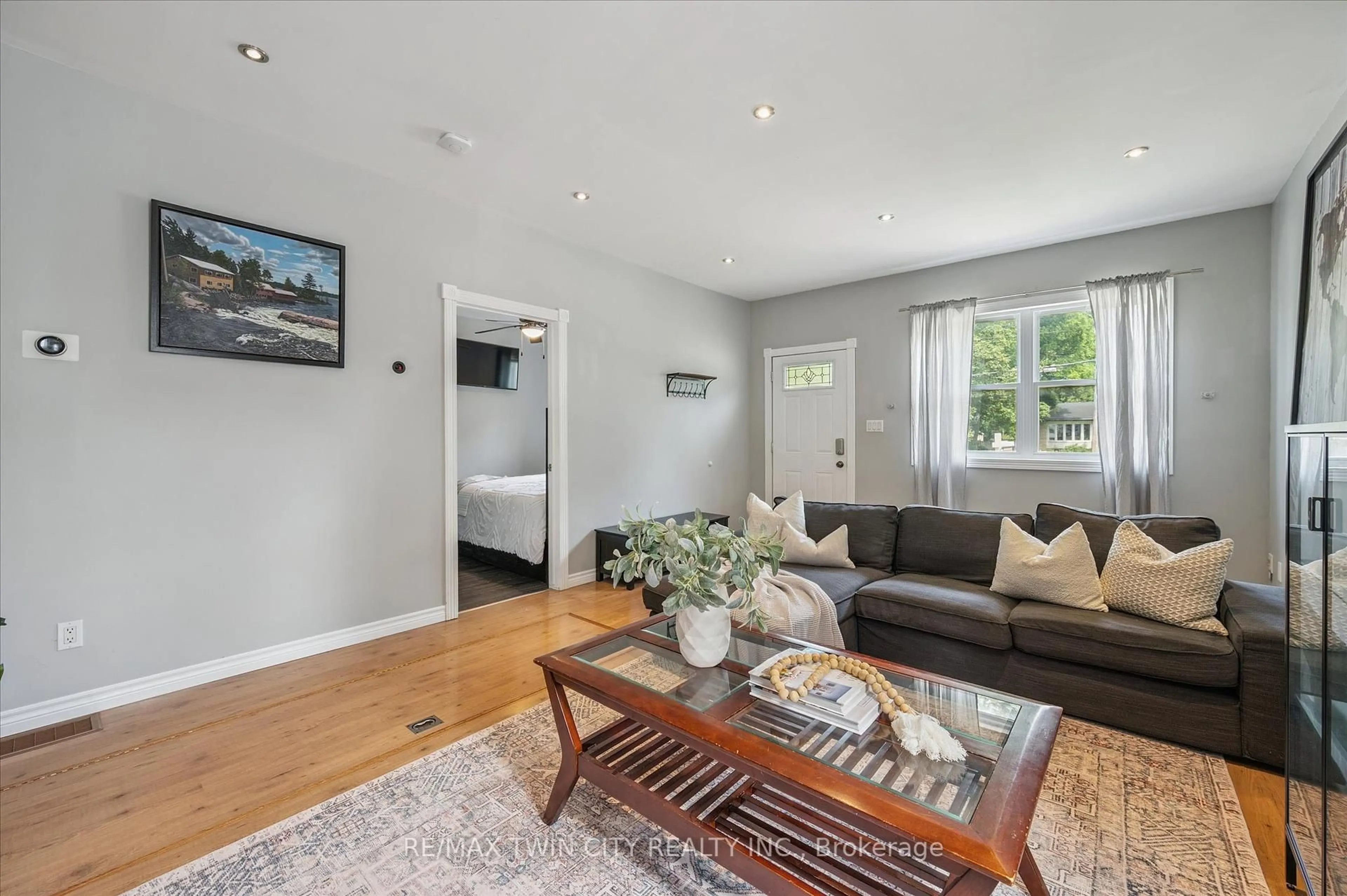 Living room with furniture, wood/laminate floor for 241 8 Highway, Hamilton Ontario L9H 5E1