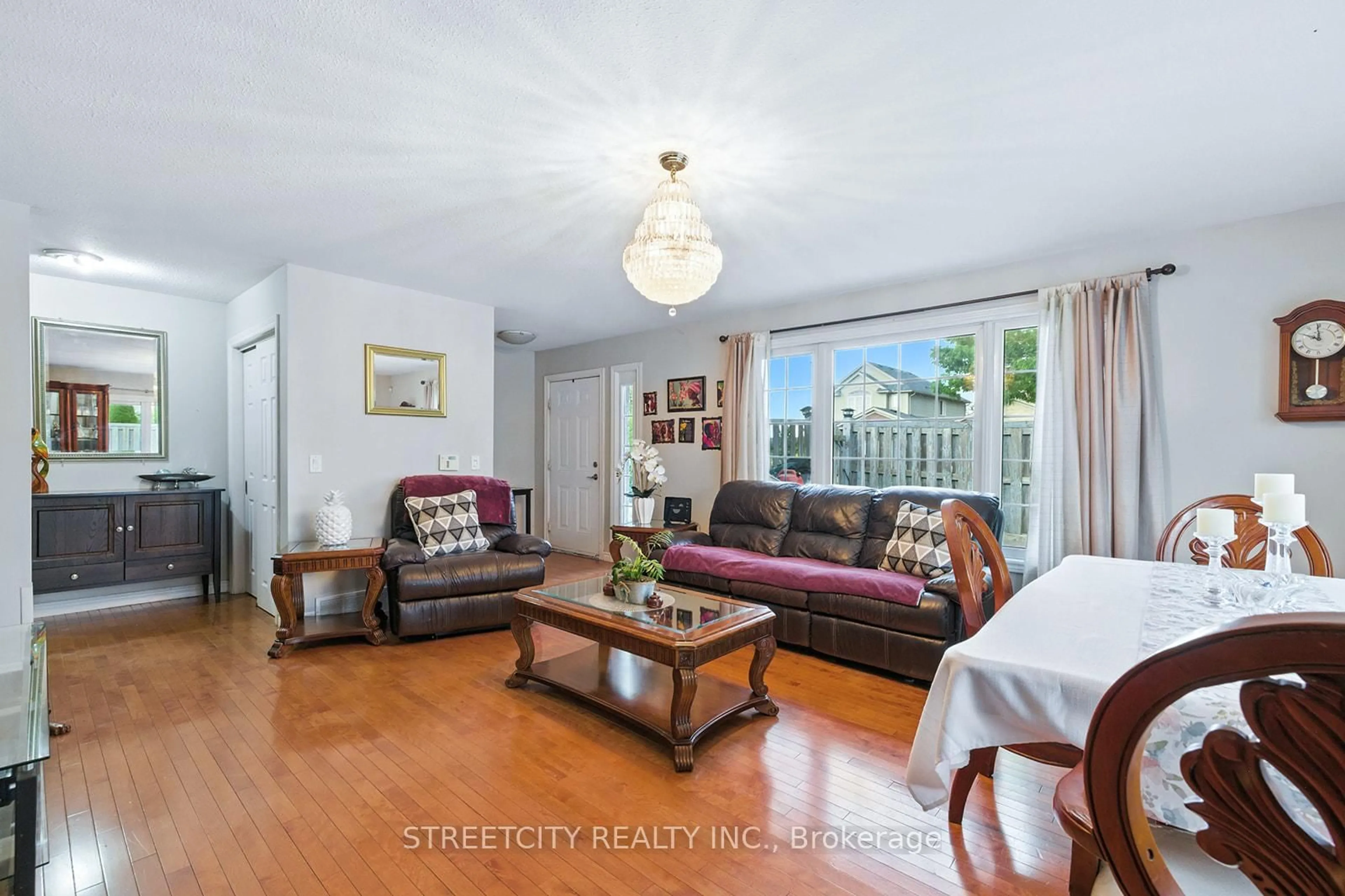 Living room with furniture, wood/laminate floor for 1673 Mcneil Rd, London South Ontario N6M 0A3