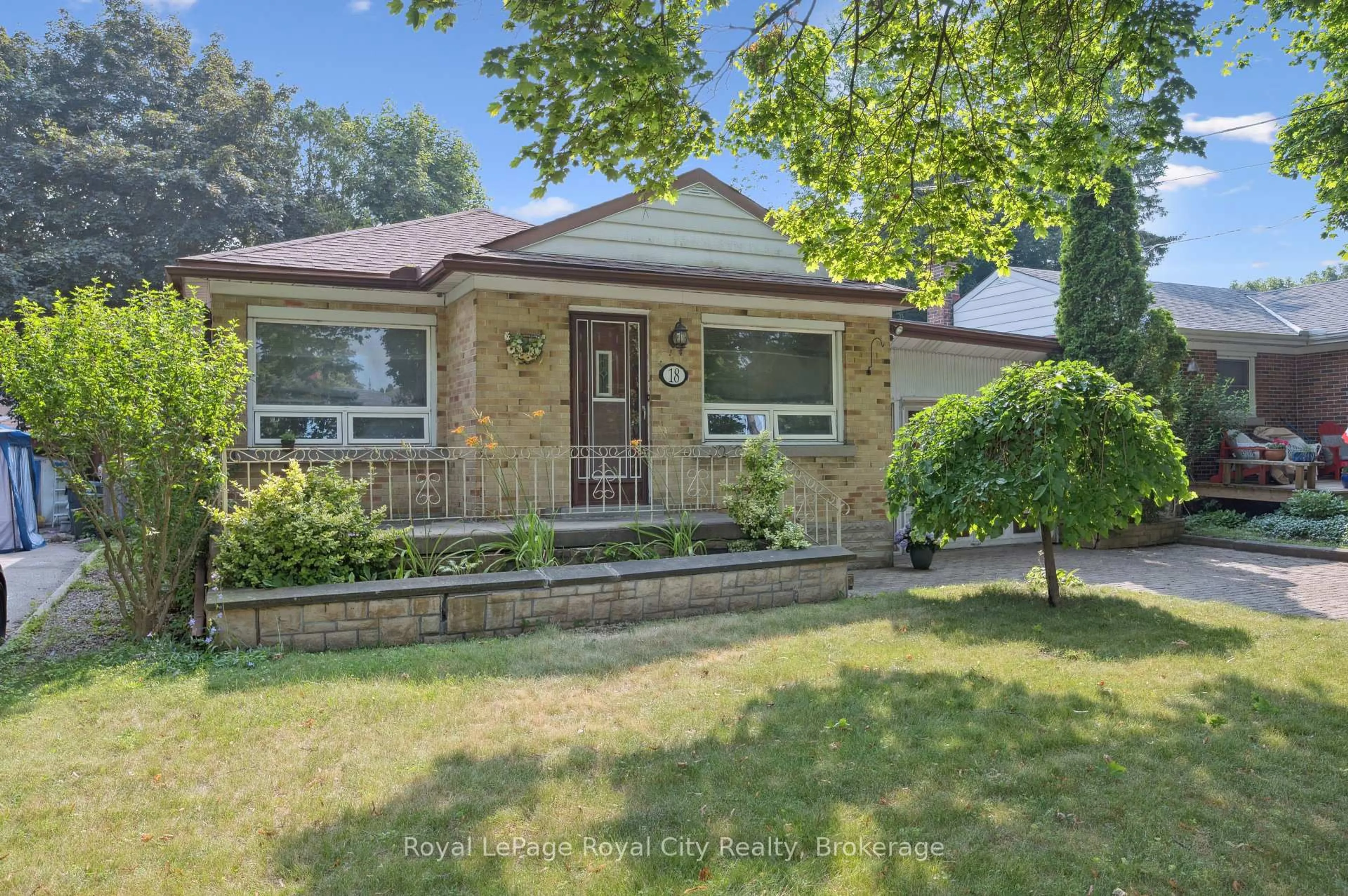 Home with brick exterior material, street for 18 Skov Cres, Guelph Ontario N1E 4B7