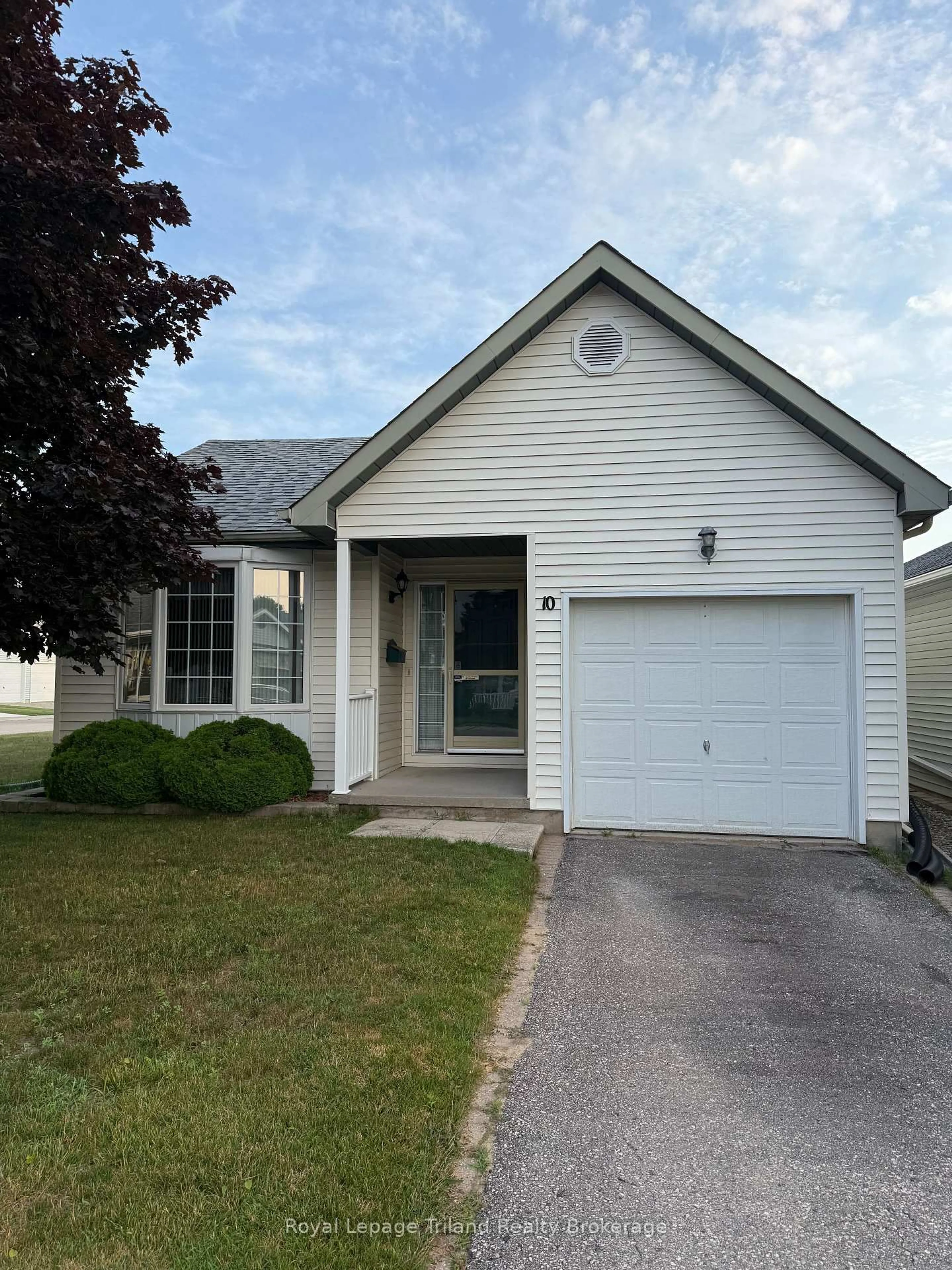 Home with vinyl exterior material, street for 10 Armstrong Dr, Tillsonburg Ontario N4G 5T3