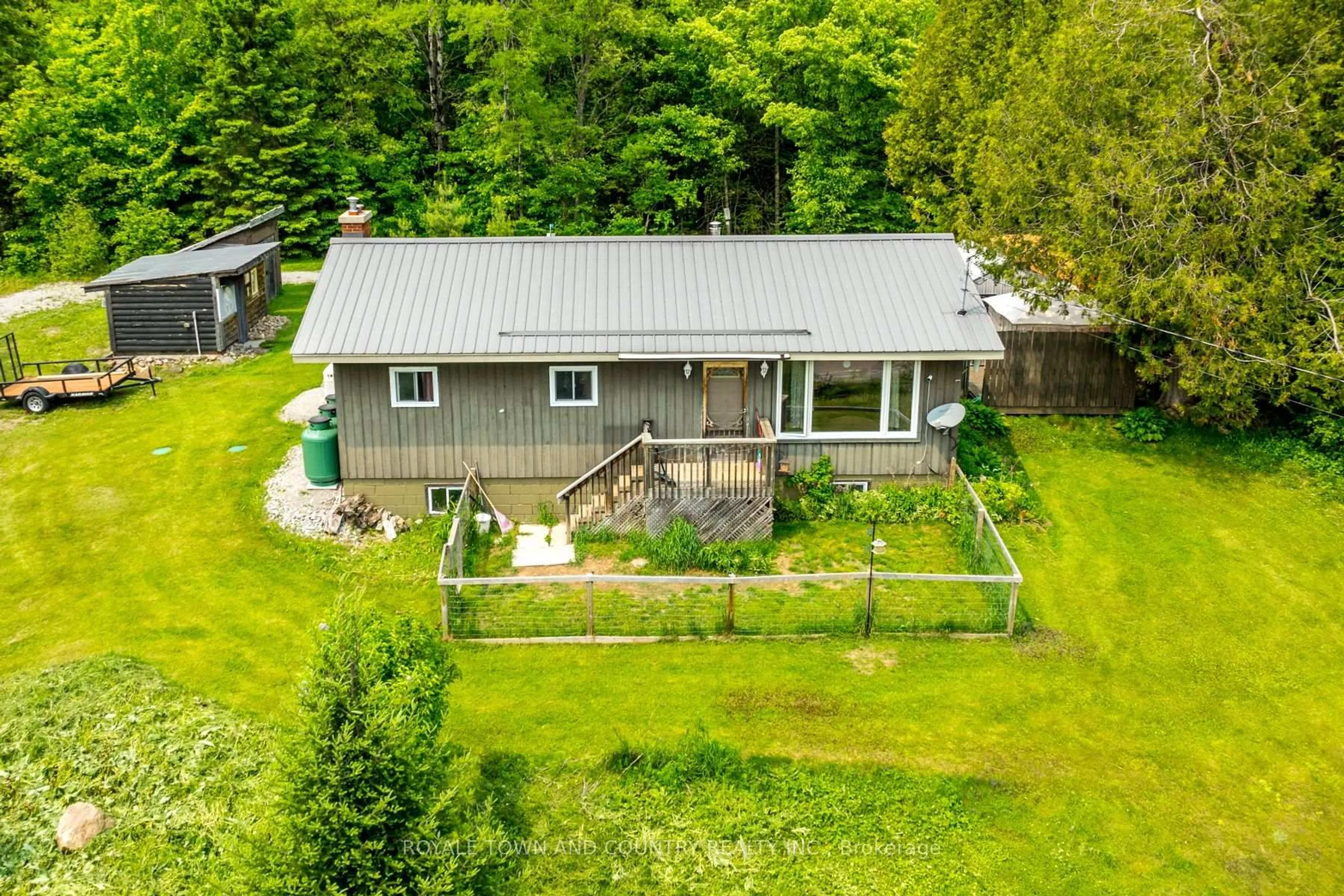 A pic from outside/outdoor area/front of a property/back of a property/a pic from drone, unknown for 1042 Tweed Dr, Highlands East Ontario K0M 1R0