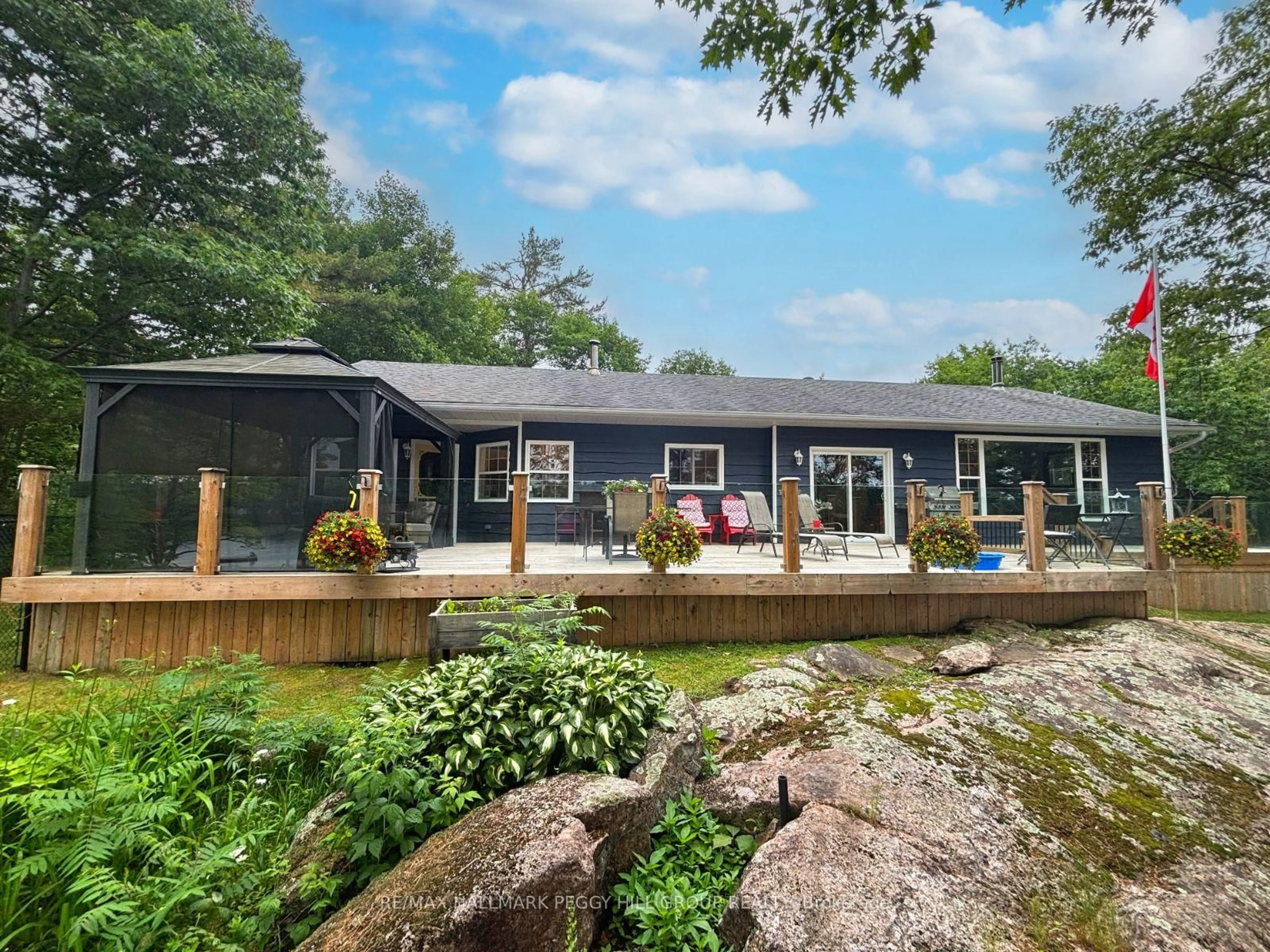 A pic from outside/outdoor area/front of a property/back of a property/a pic from drone, water/lake/river/ocean view for 1008 Cove Rd, Gravenhurst Ontario P0E 1G0
