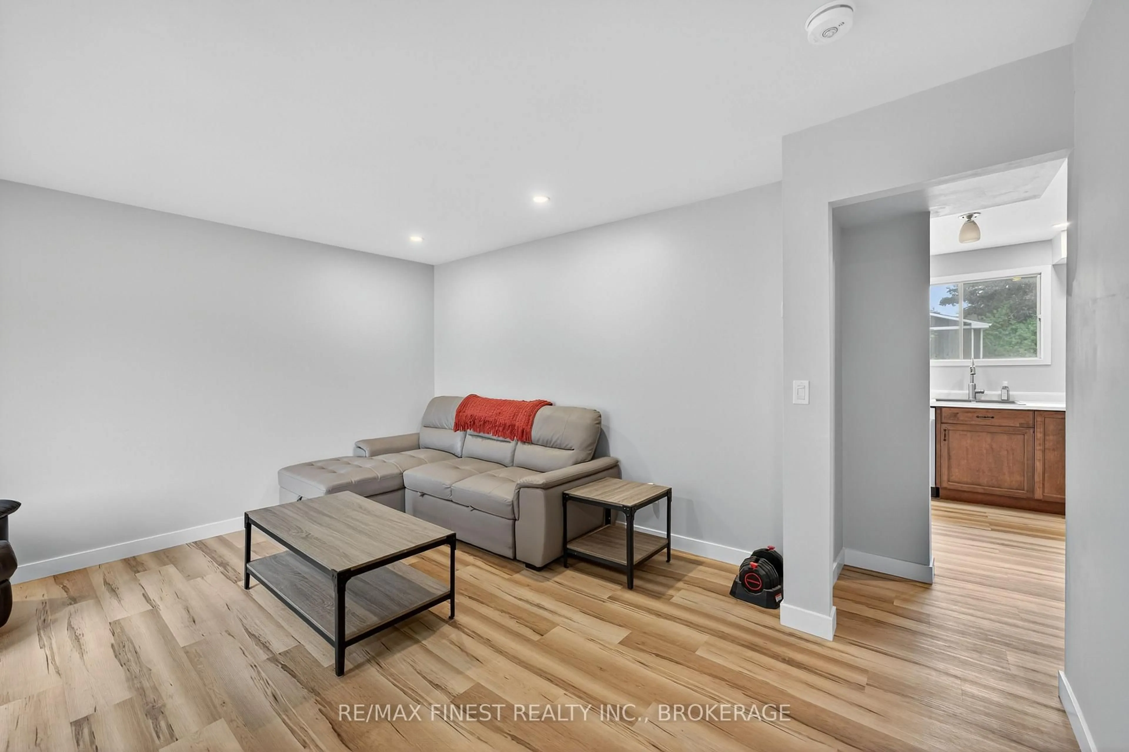 Living room with furniture, wood/laminate floor for 937 Purcell Cres, Kingston Ontario K7P 1C1