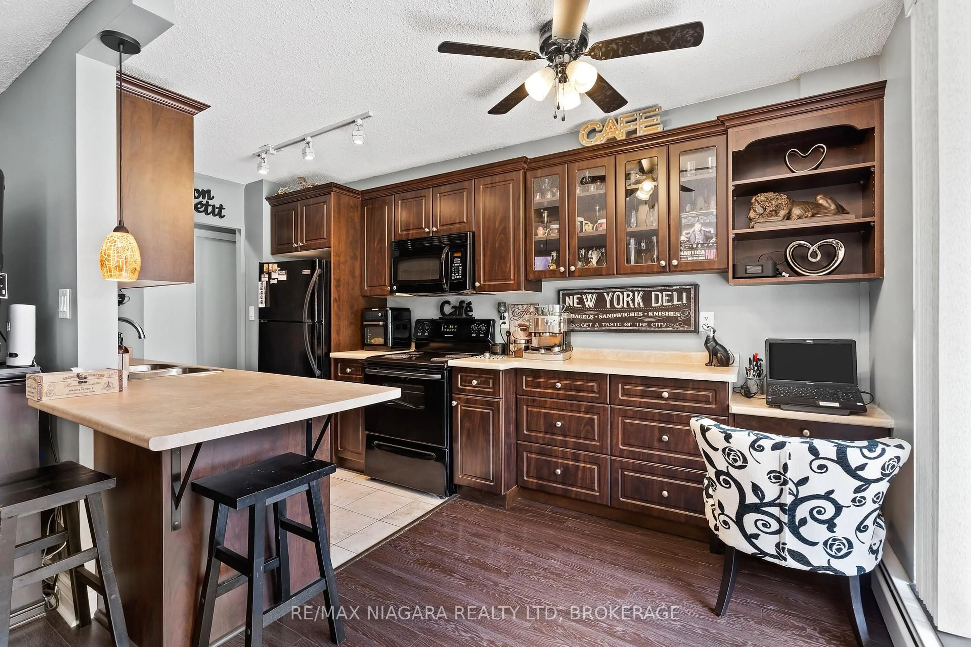 Open concept kitchen, ceramic/tile floor for 6390 Huggins St #205, Niagara Falls Ontario L2J 1H1