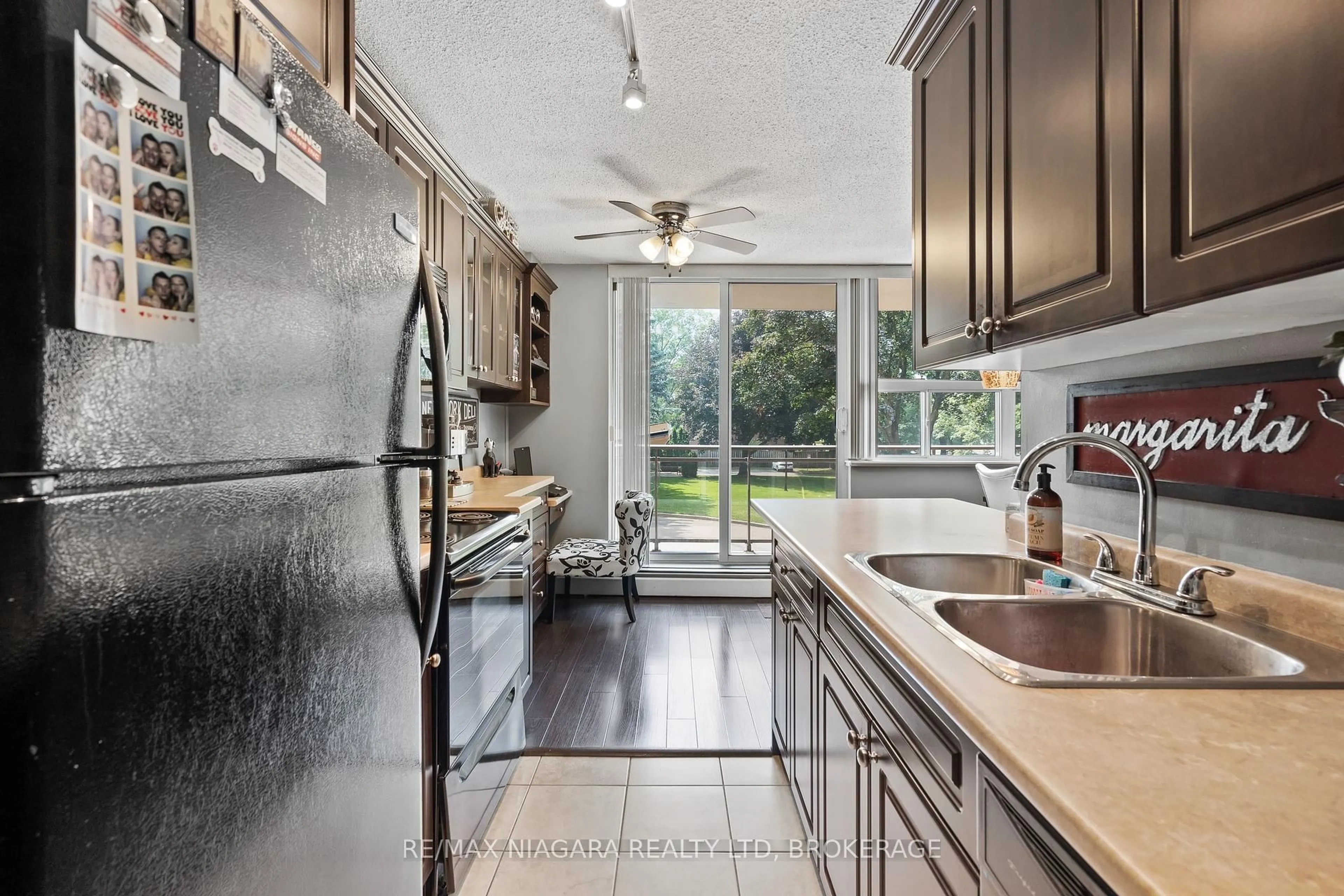 Open concept kitchen, ceramic/tile floor for 6390 Huggins St #205, Niagara Falls Ontario L2J 1H1