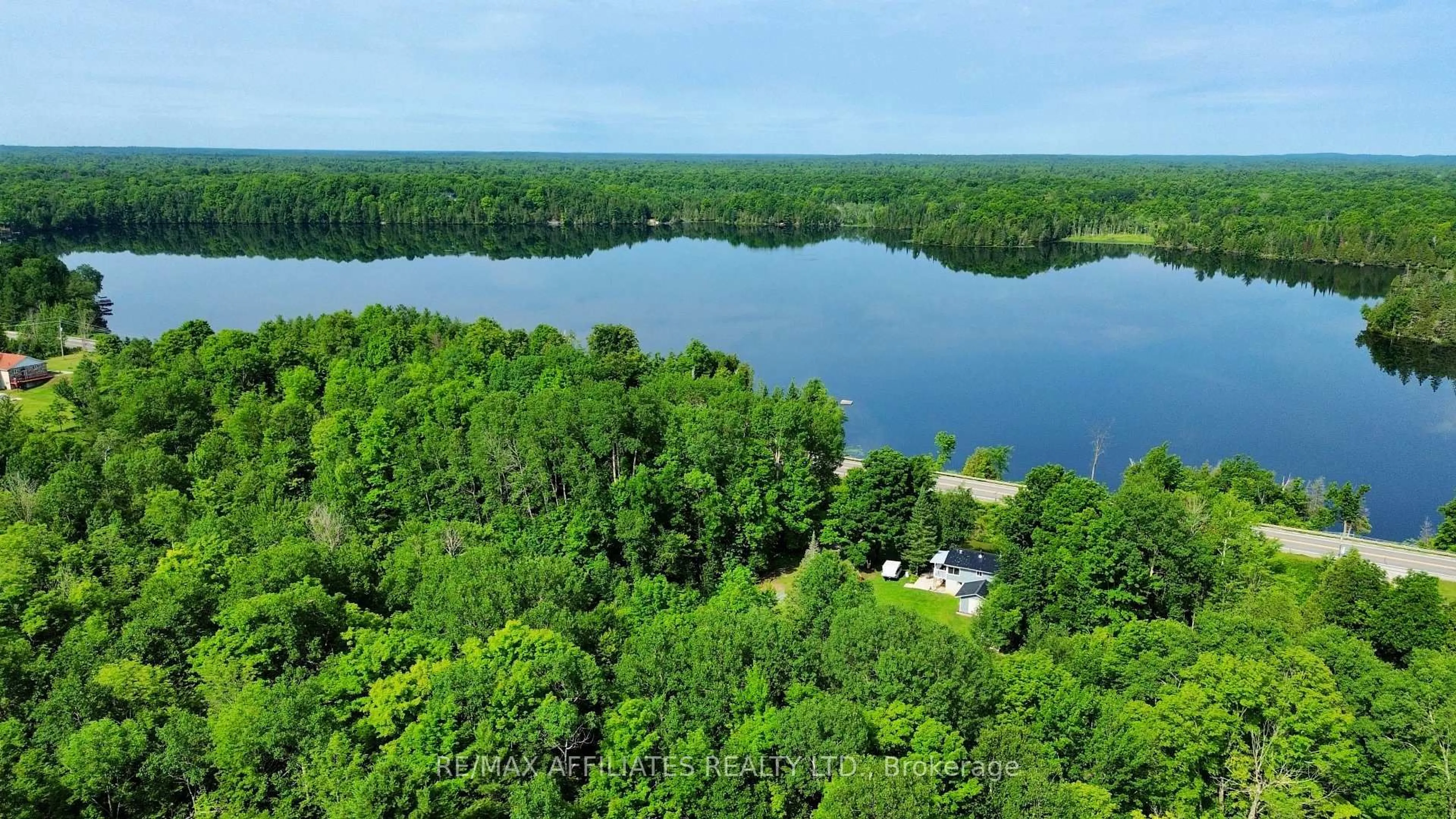 A pic from outside/outdoor area/front of a property/back of a property/a pic from drone, water/lake/river/ocean view for 13198 38 Rd, Sharbot Lake Ontario K0H 2P0
