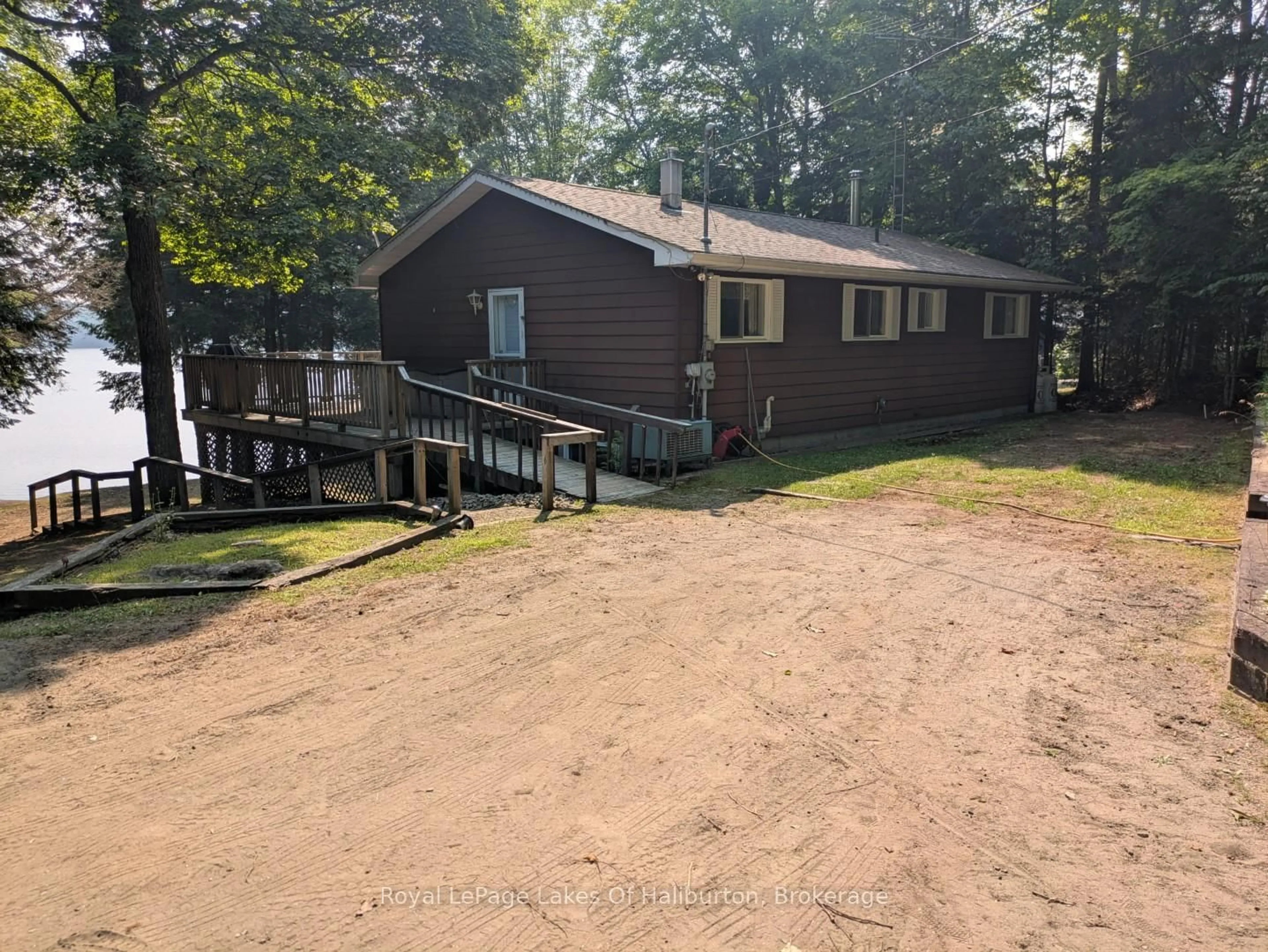 A pic from outside/outdoor area/front of a property/back of a property/a pic from drone, water/lake/river/ocean view for 1051 Autumn Lane, Dysart et al Ontario K0M 1S0