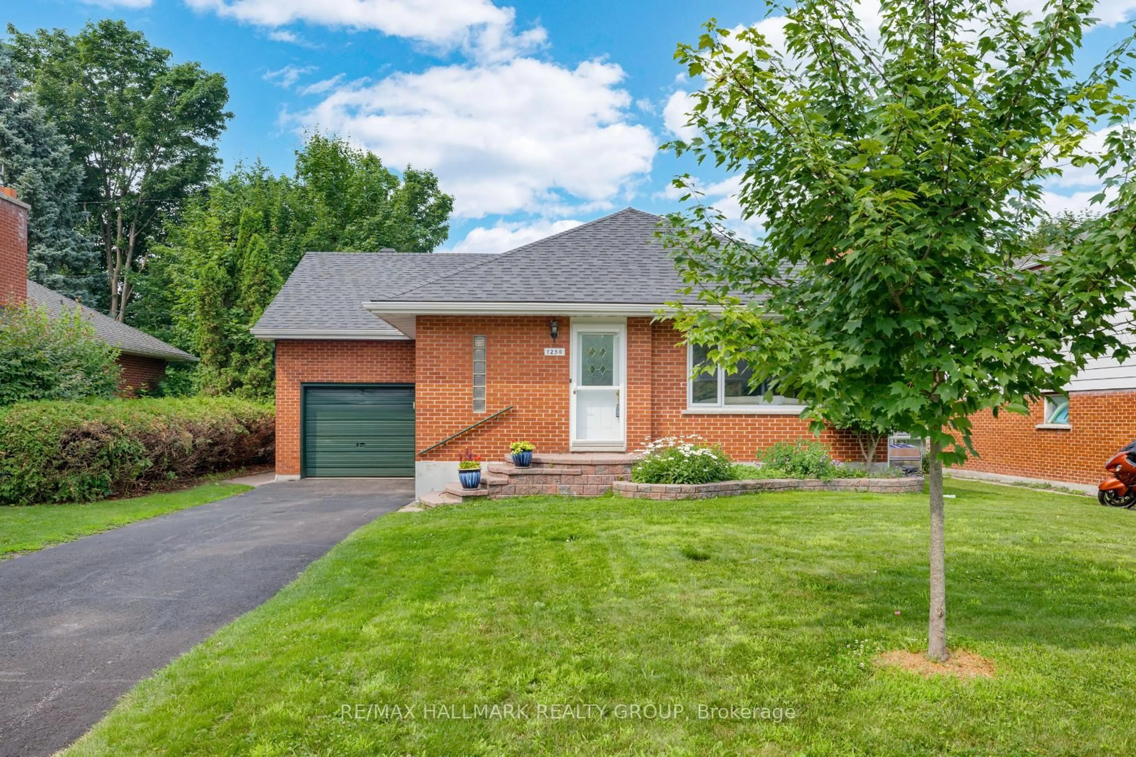 Home with brick exterior material, street for 1250 Woodside Dr, Ottawa Ontario K2C 2G9