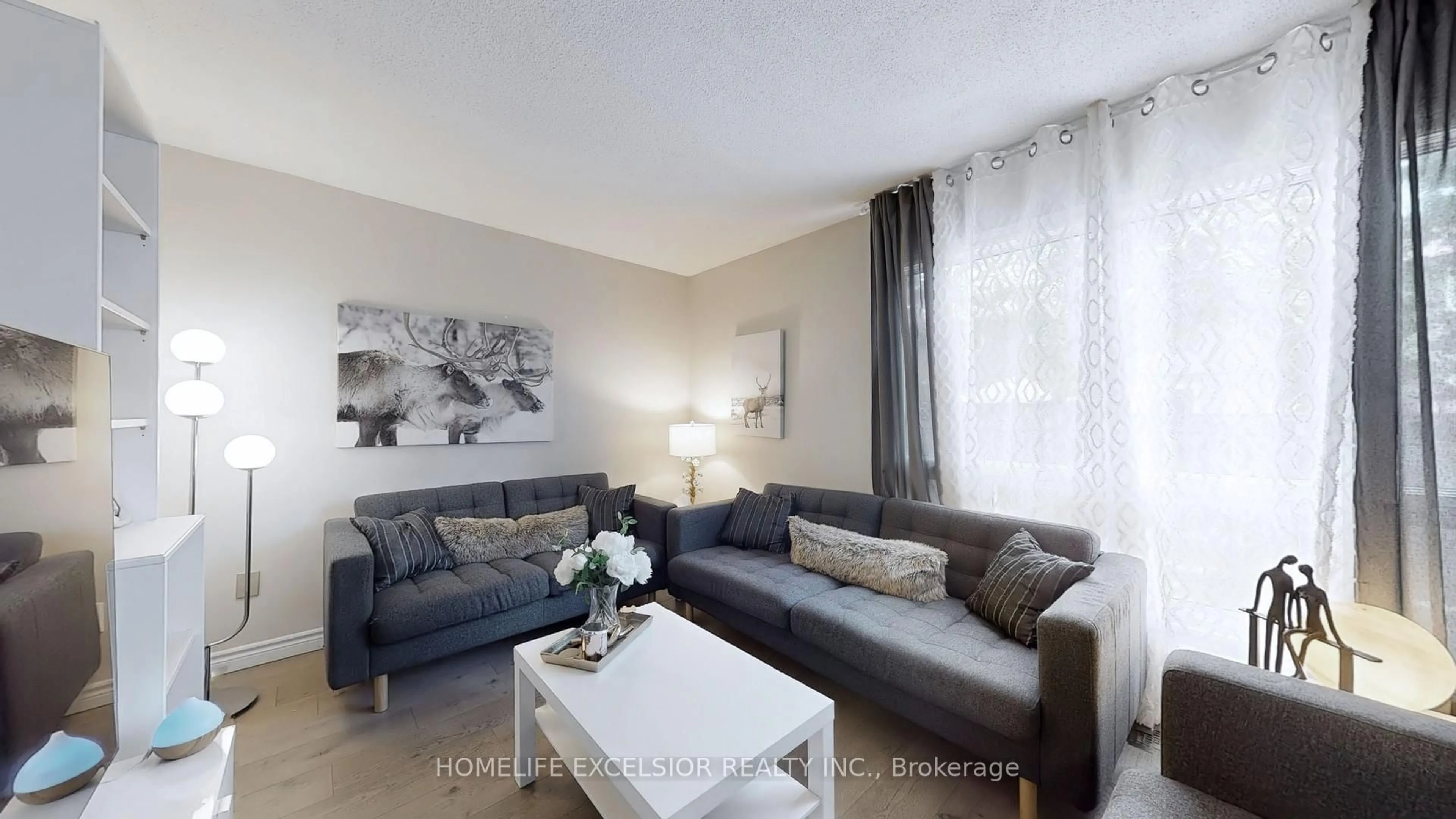 Living room with furniture, unknown for 618 Barton St #33, Hamilton Ontario L8E 4X3