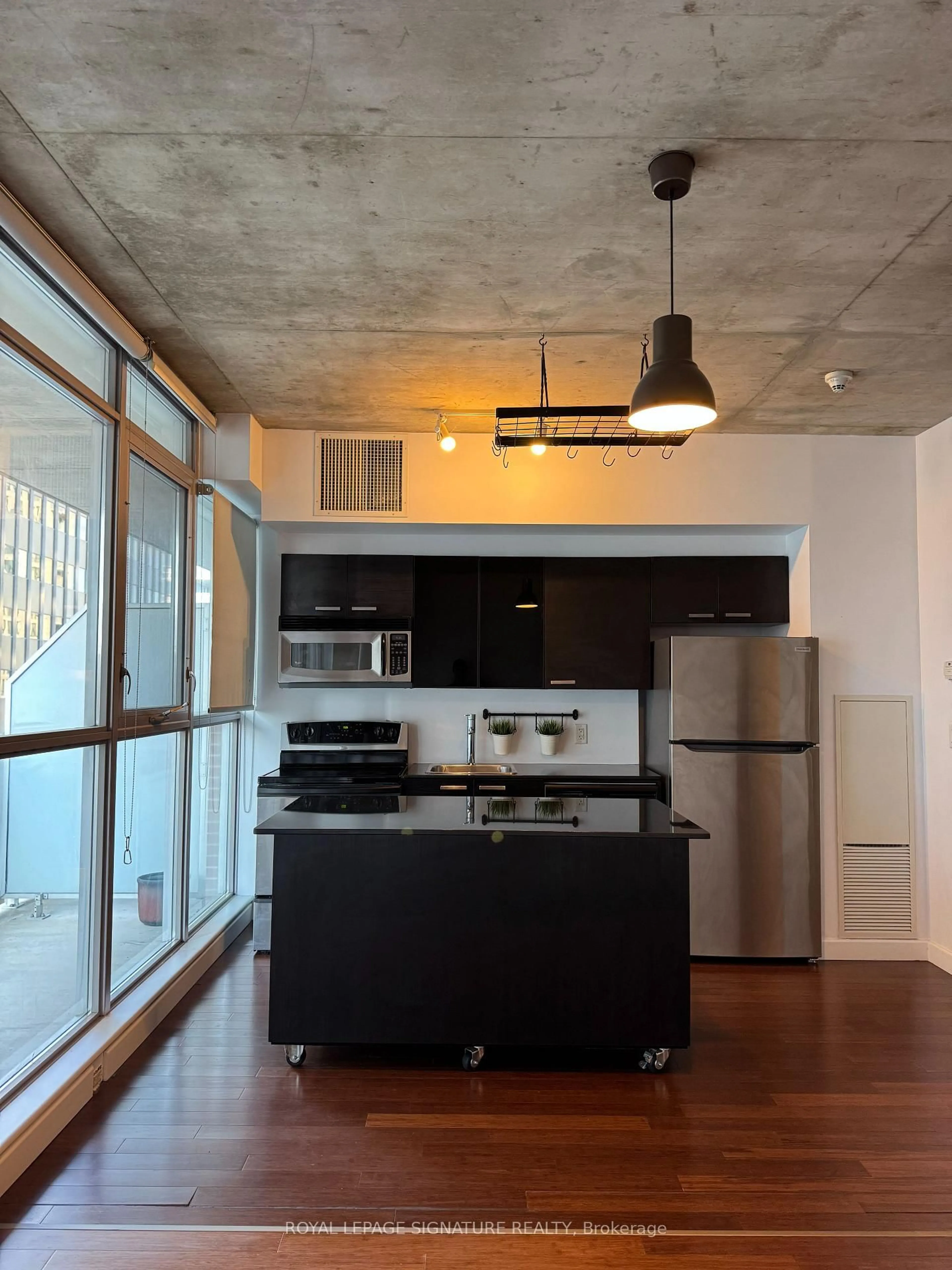 Open concept kitchen, cement floor for 179 GEORGE St #1004, Ottawa Ontario K1N 1J8