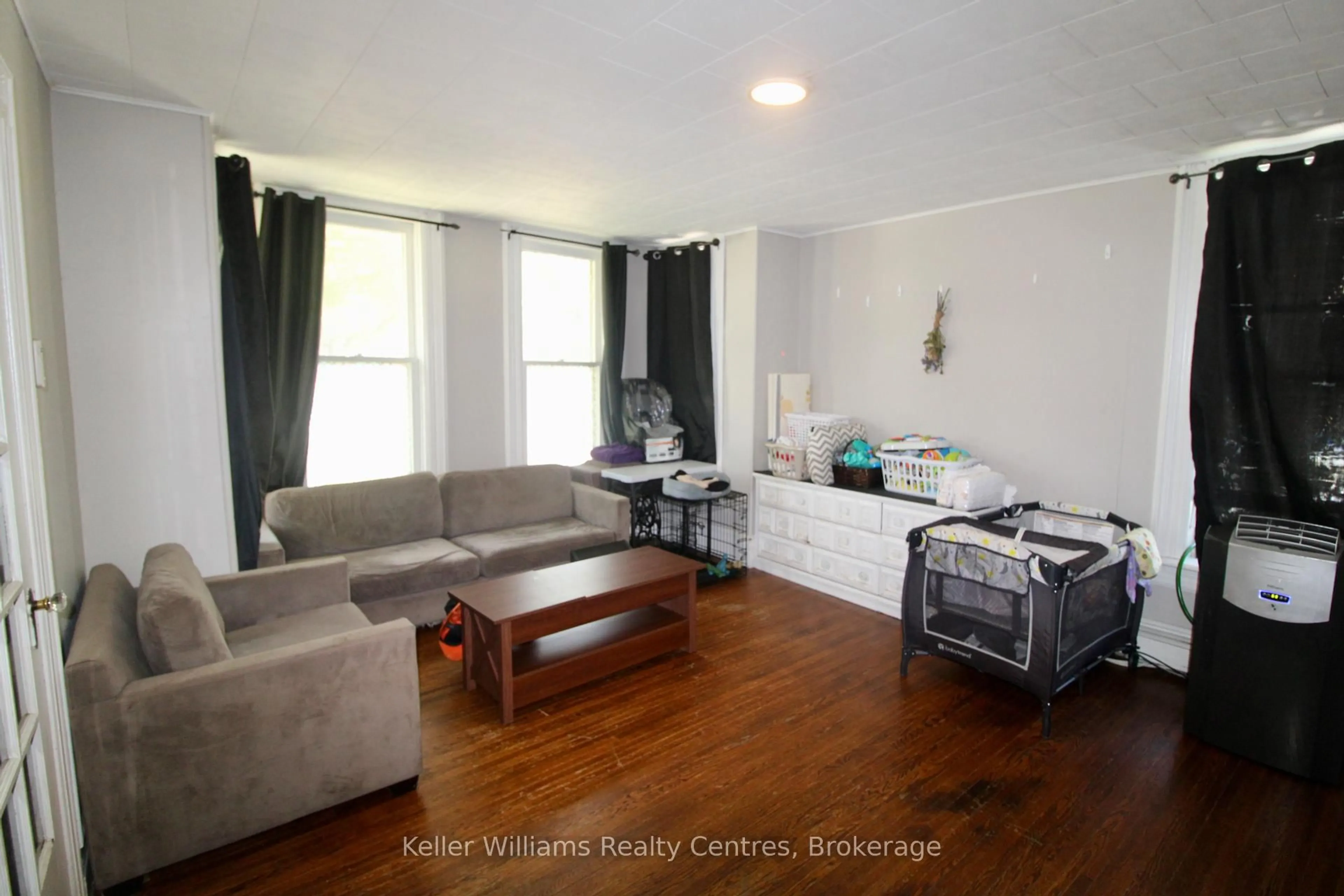 Living room with furniture, wood/laminate floor for 163/165 Countess St, West Grey Ontario N0G 1R0