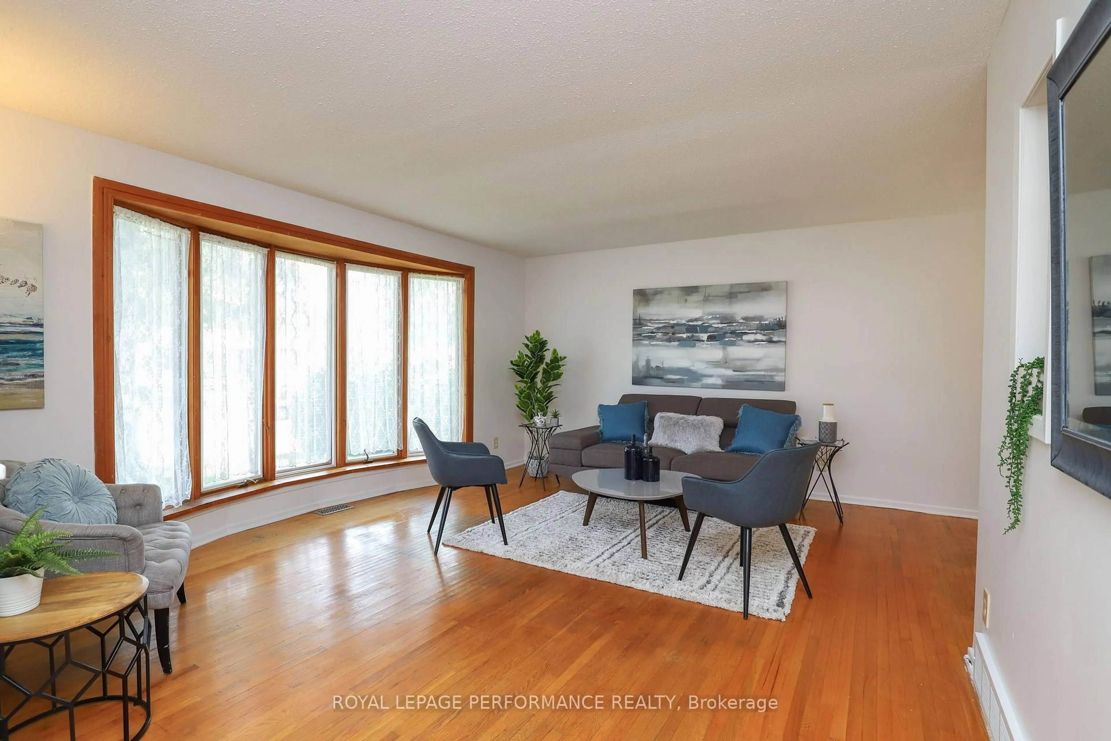 Living room with furniture, wood/laminate floor for 45 Keewatin Cres, Ottawa Ontario K2E 5S2