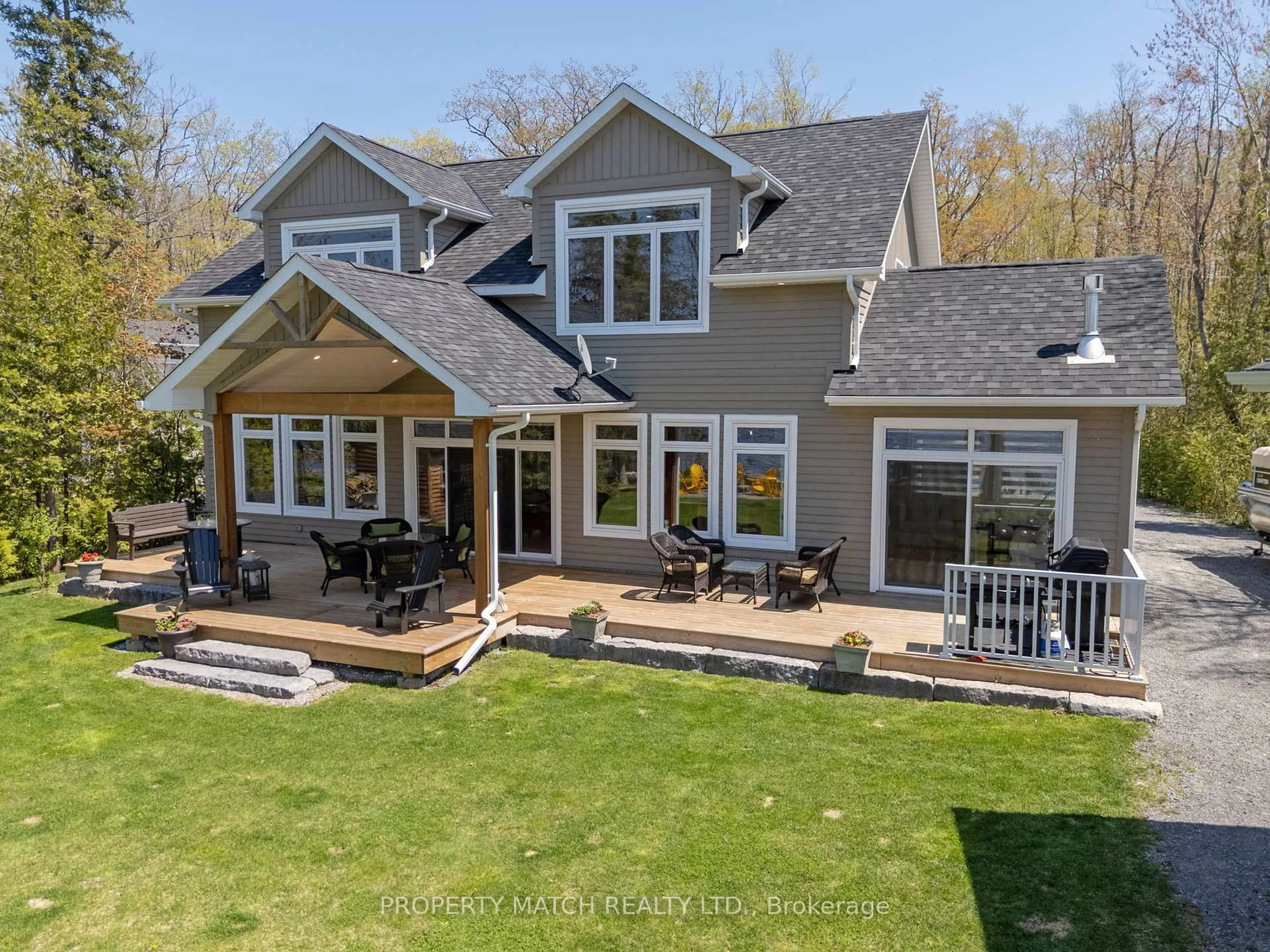 A pic from outside/outdoor area/front of a property/back of a property/a pic from drone, water/lake/river/ocean view for 185 Fire Route 72, Trent Lakes Ontario K0L 1J0
