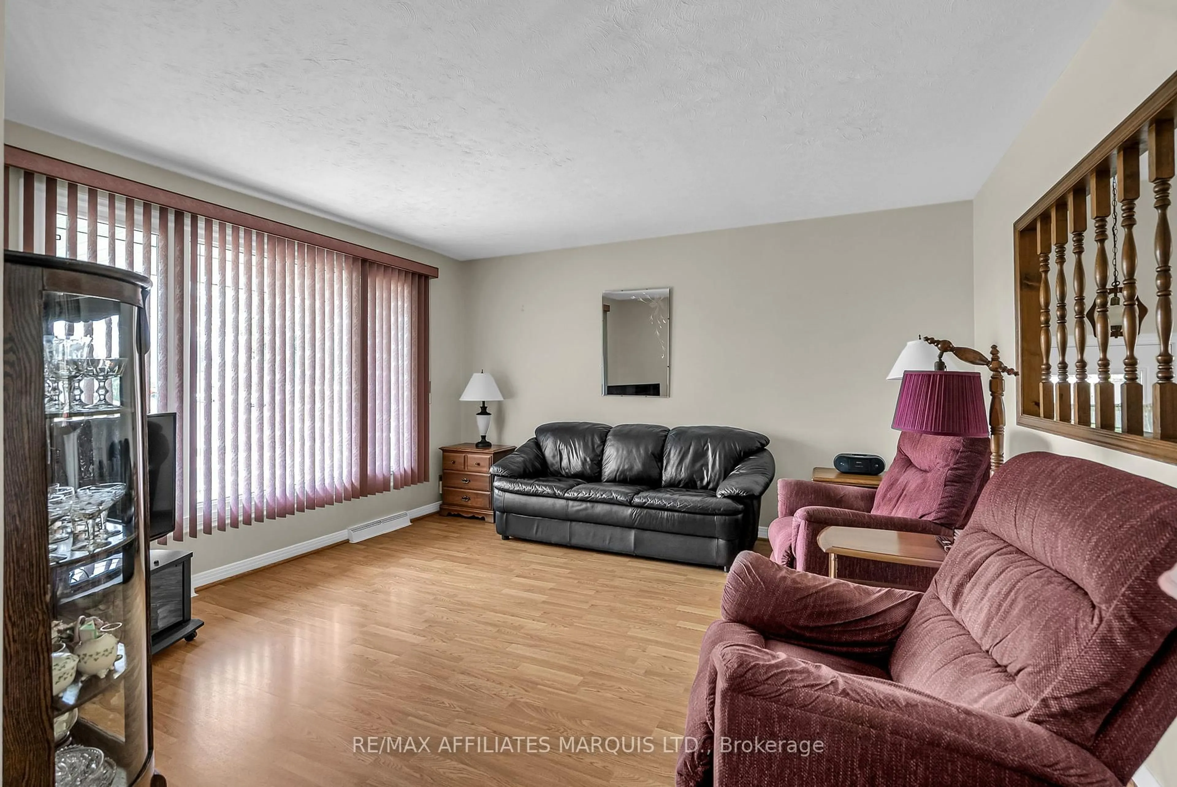 Living room with furniture, wood/laminate floor for 1405 Norman Ave, Cornwall Ontario K6J 4X5
