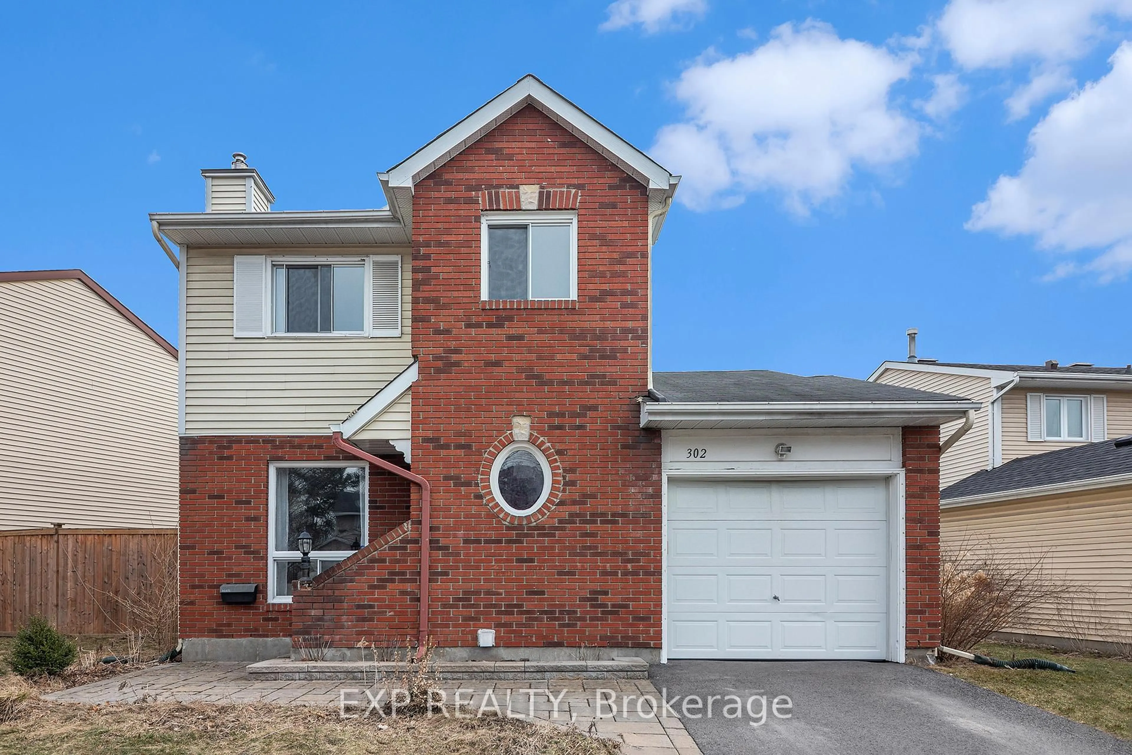Home with brick exterior material, street for 302 Cote-Royale Cres, Ottawa Ontario K1E 3L7