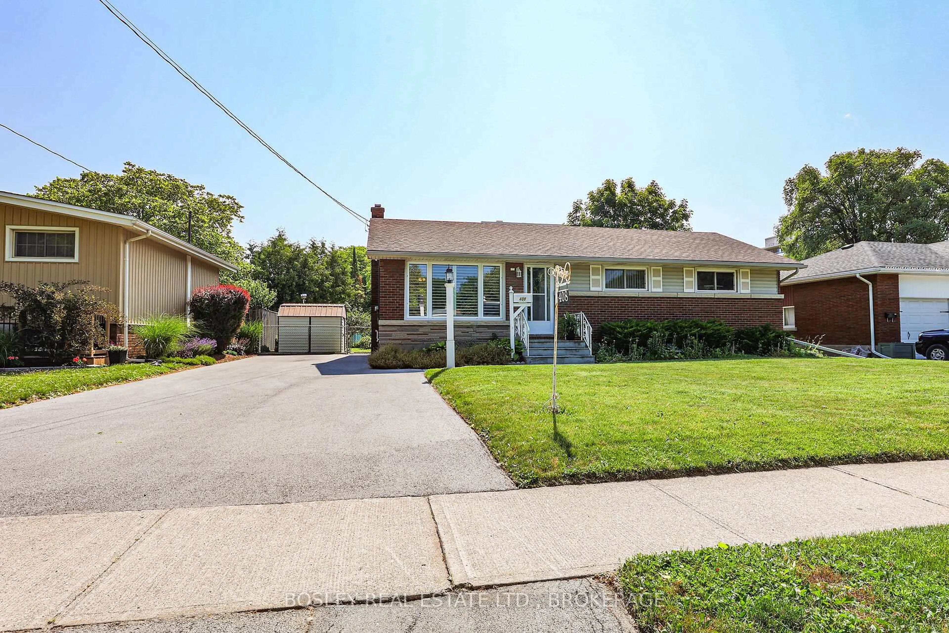Home with brick exterior material, street for 408 Bunting Rd, St. Catharines Ontario L2M 3Z2