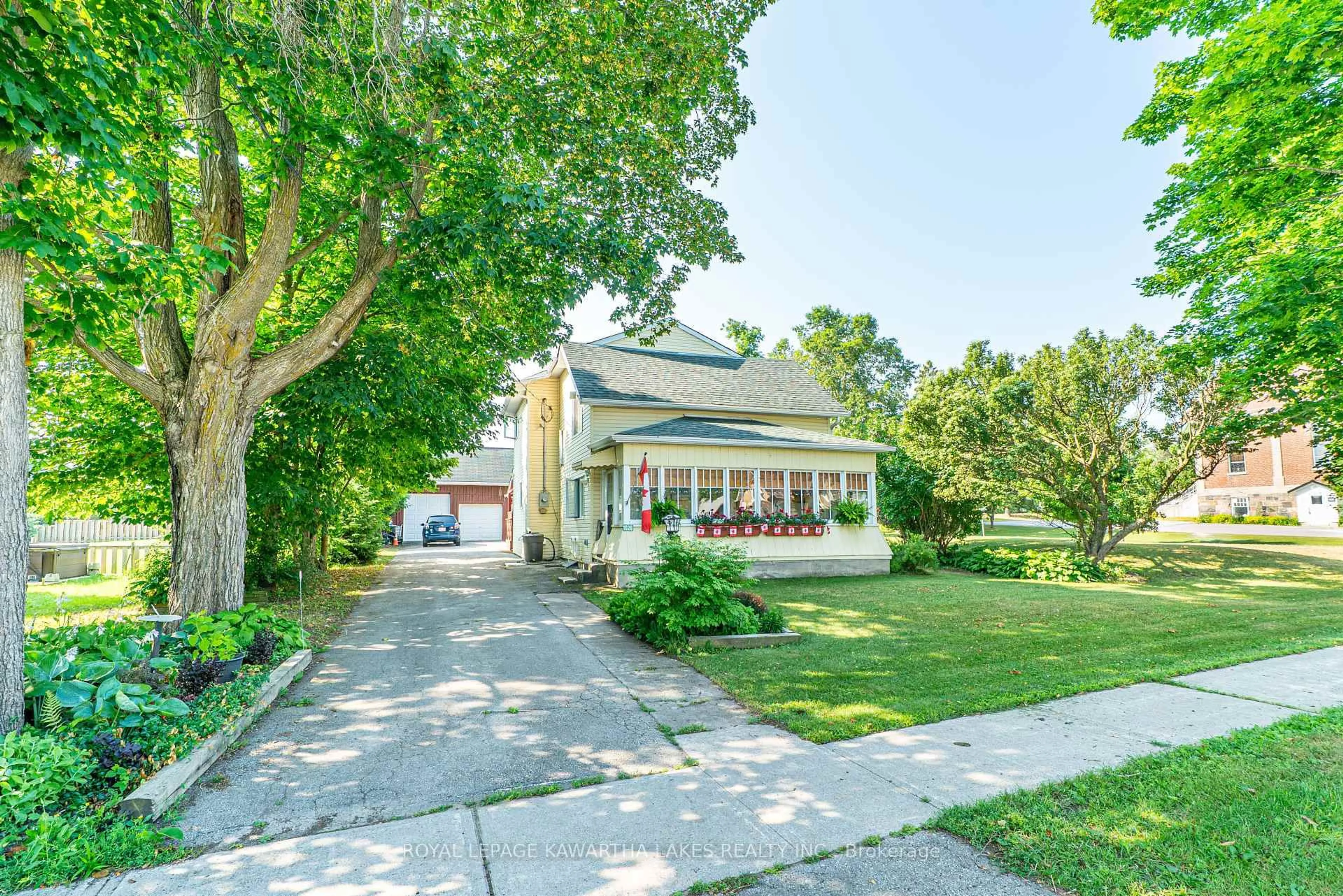 A pic from outside/outdoor area/front of a property/back of a property/a pic from drone, street for 1028 Little Britain Rd, Kawartha Lakes Ontario K0M 2C0
