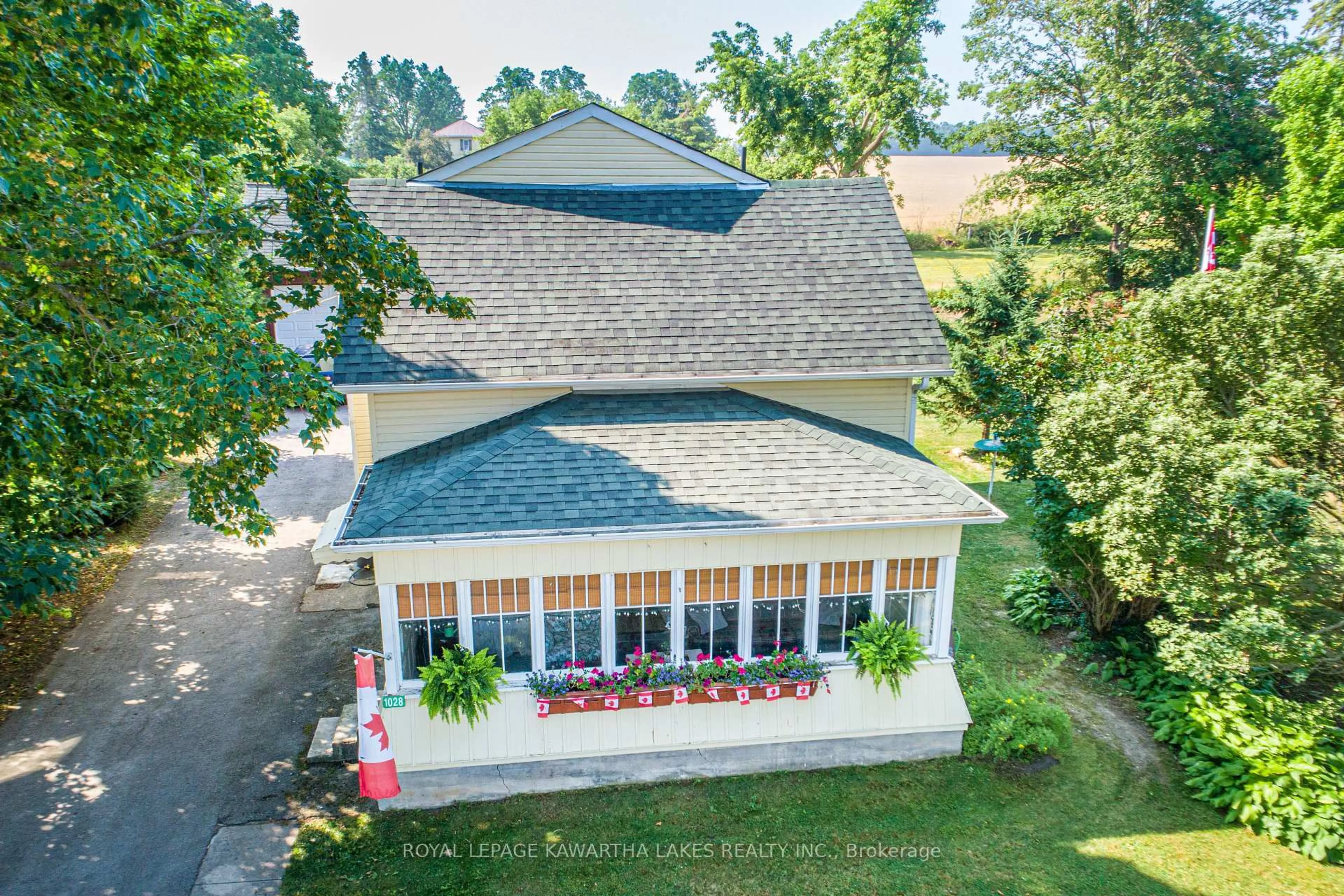A pic from outside/outdoor area/front of a property/back of a property/a pic from drone, unknown for 1028 Little Britain Rd, Kawartha Lakes Ontario K0M 2C0