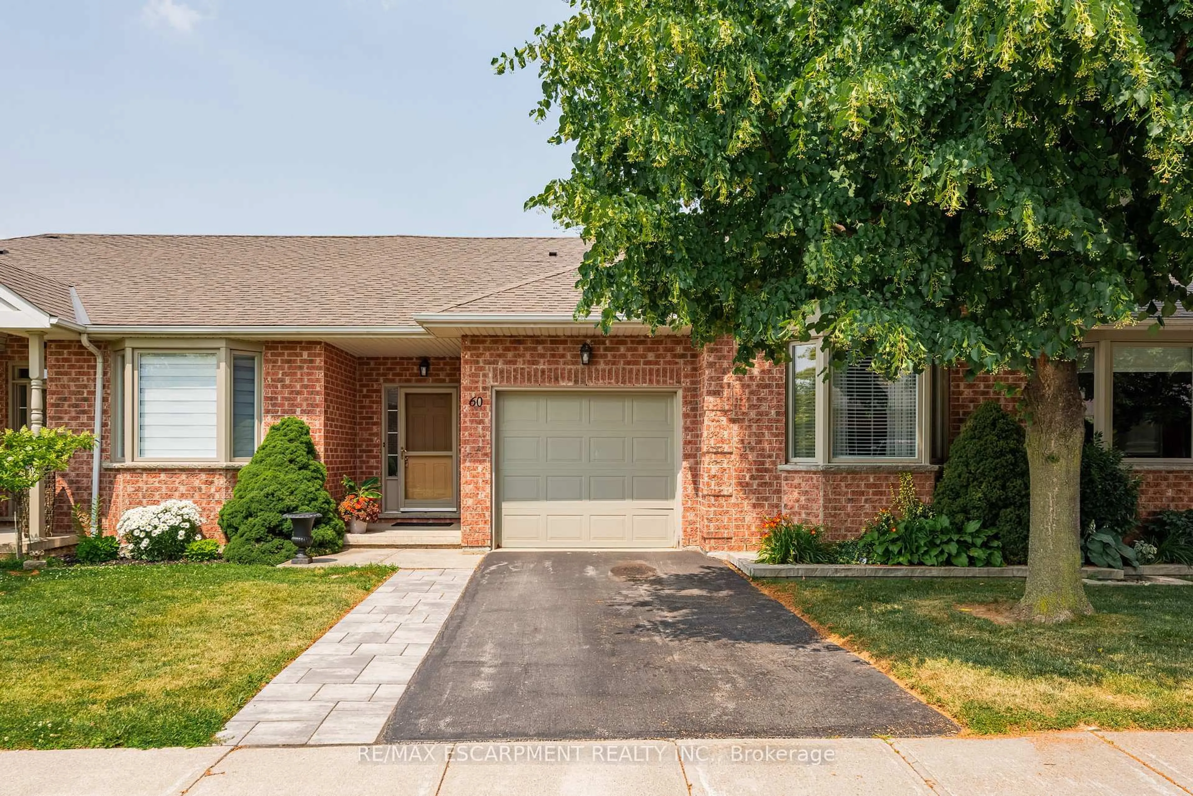 Home with brick exterior material, street for 60 Riveroaks Dr, Hamilton Ontario L0R 1W0