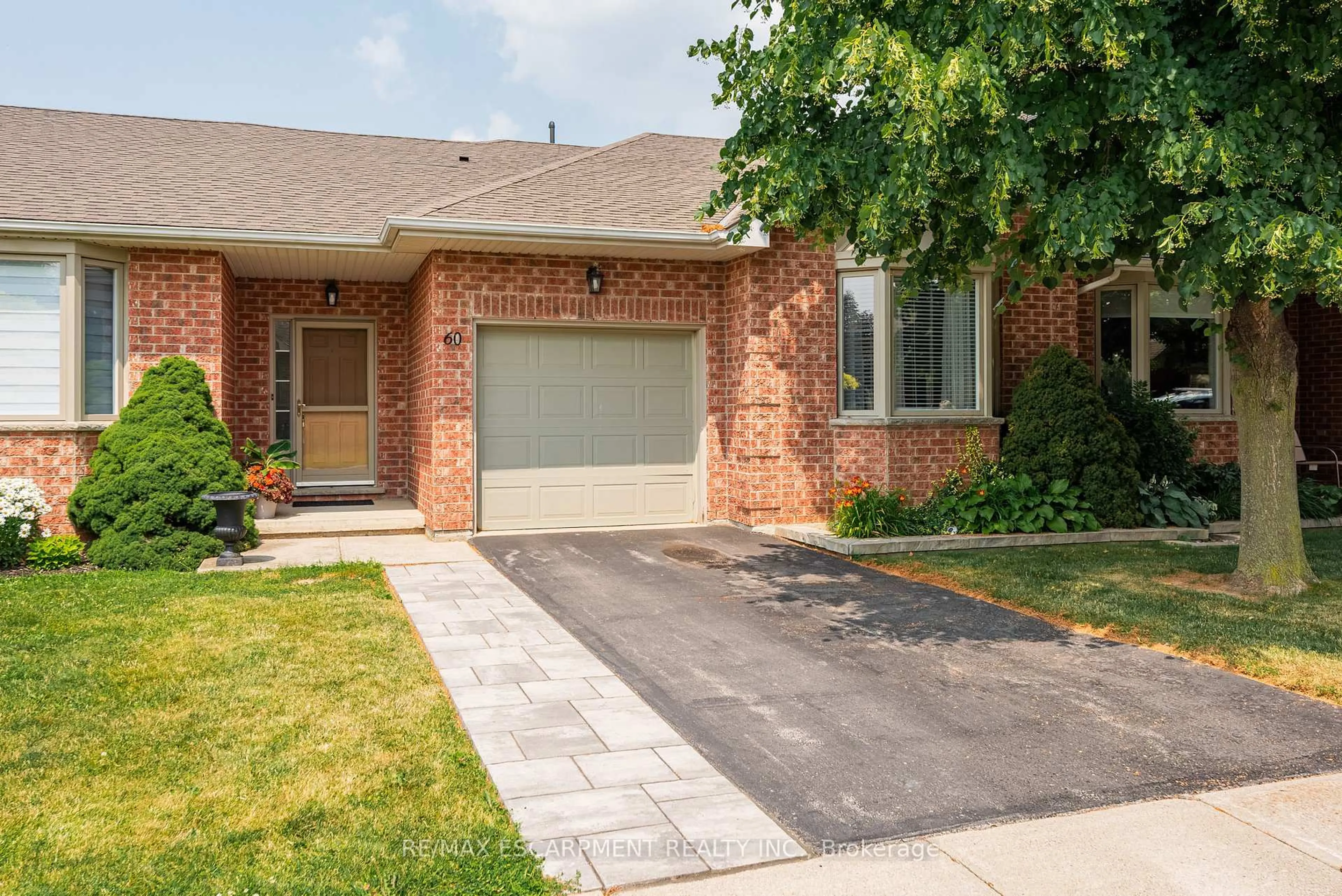 Home with brick exterior material, street for 60 Riveroaks Dr, Hamilton Ontario L0R 1W0