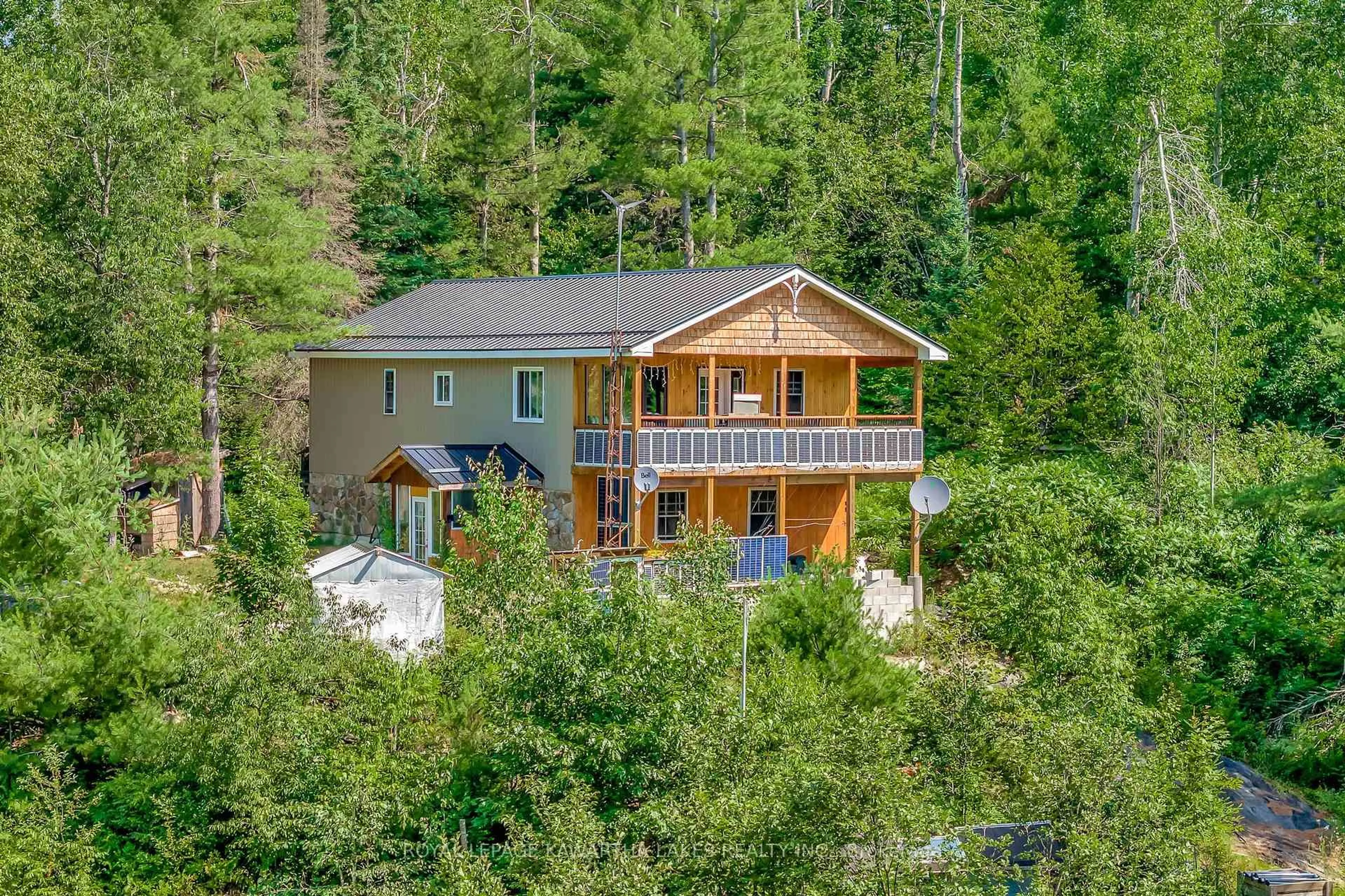 A pic from outside/outdoor area/front of a property/back of a property/a pic from drone, water/lake/river/ocean view for 707 Galway Rd, Trent Lakes Ontario K0M 2A0