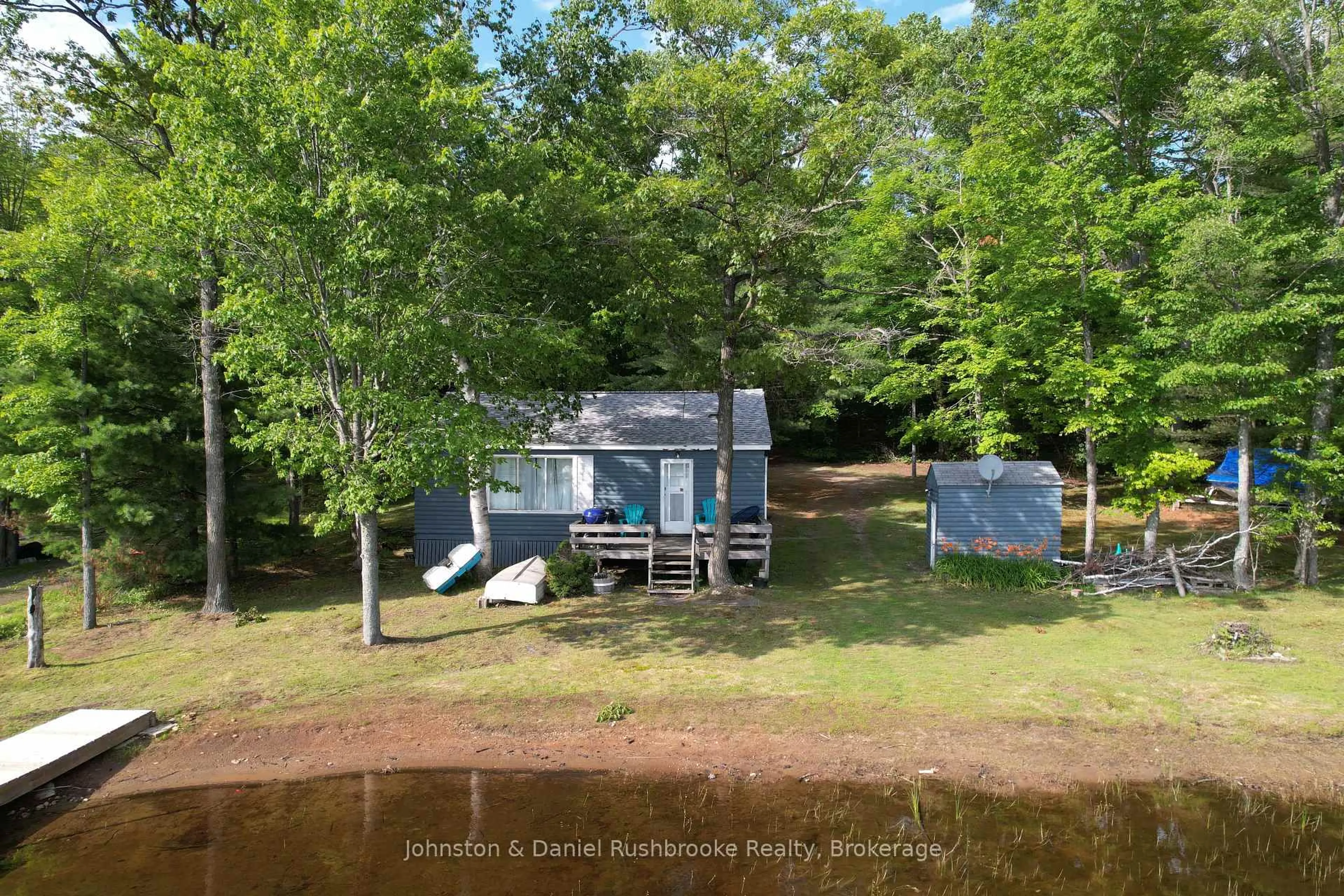 A pic from outside/outdoor area/front of a property/back of a property/a pic from drone, water/lake/river/ocean view for 1102 Ridge Rd #4, Muskoka Lakes Ontario P0C 1M0