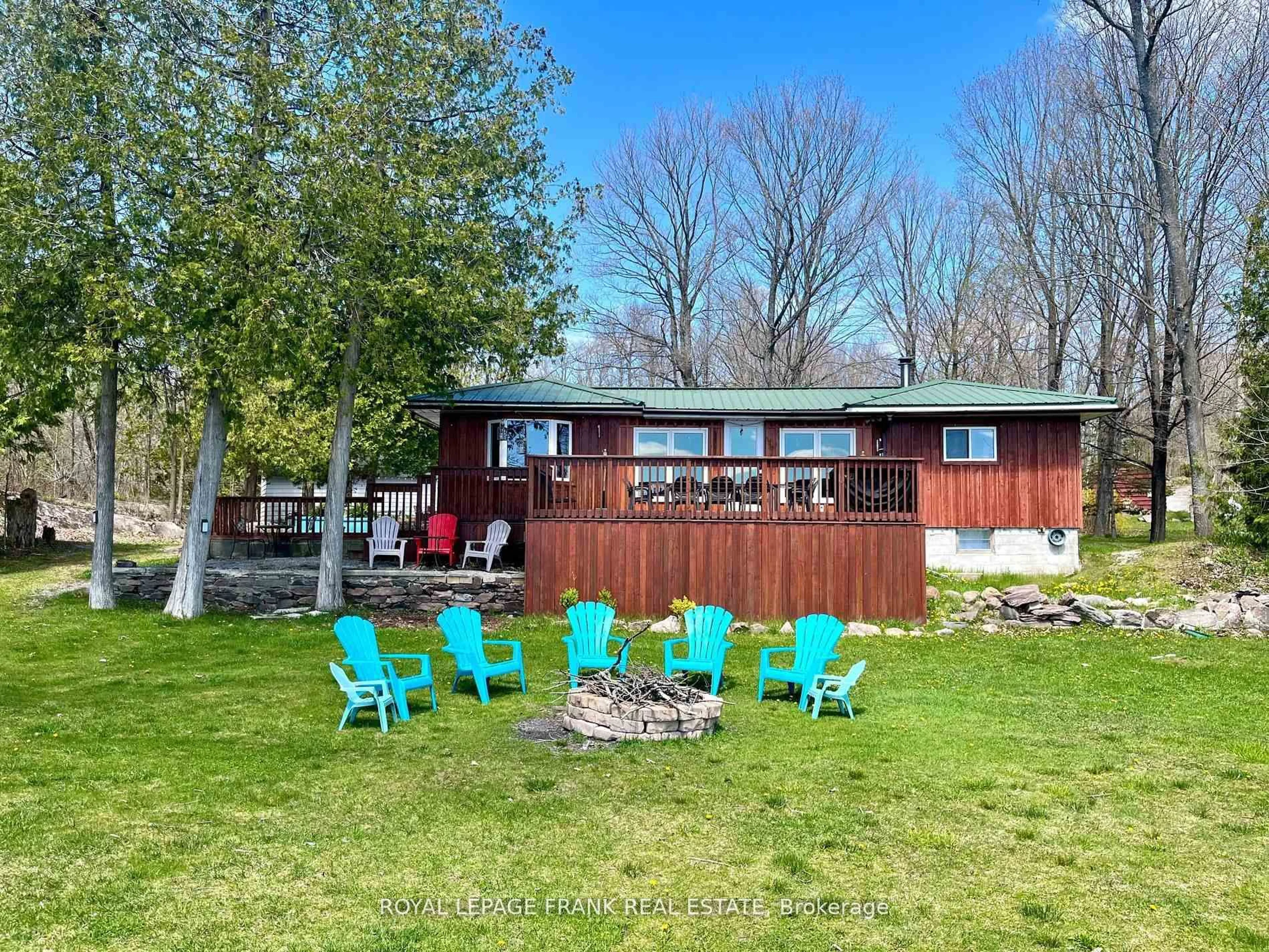 A pic from outside/outdoor area/front of a property/back of a property/a pic from drone, water/lake/river/ocean view for 95 Fire Route 12, Trent Lakes Ontario K0L 1J0